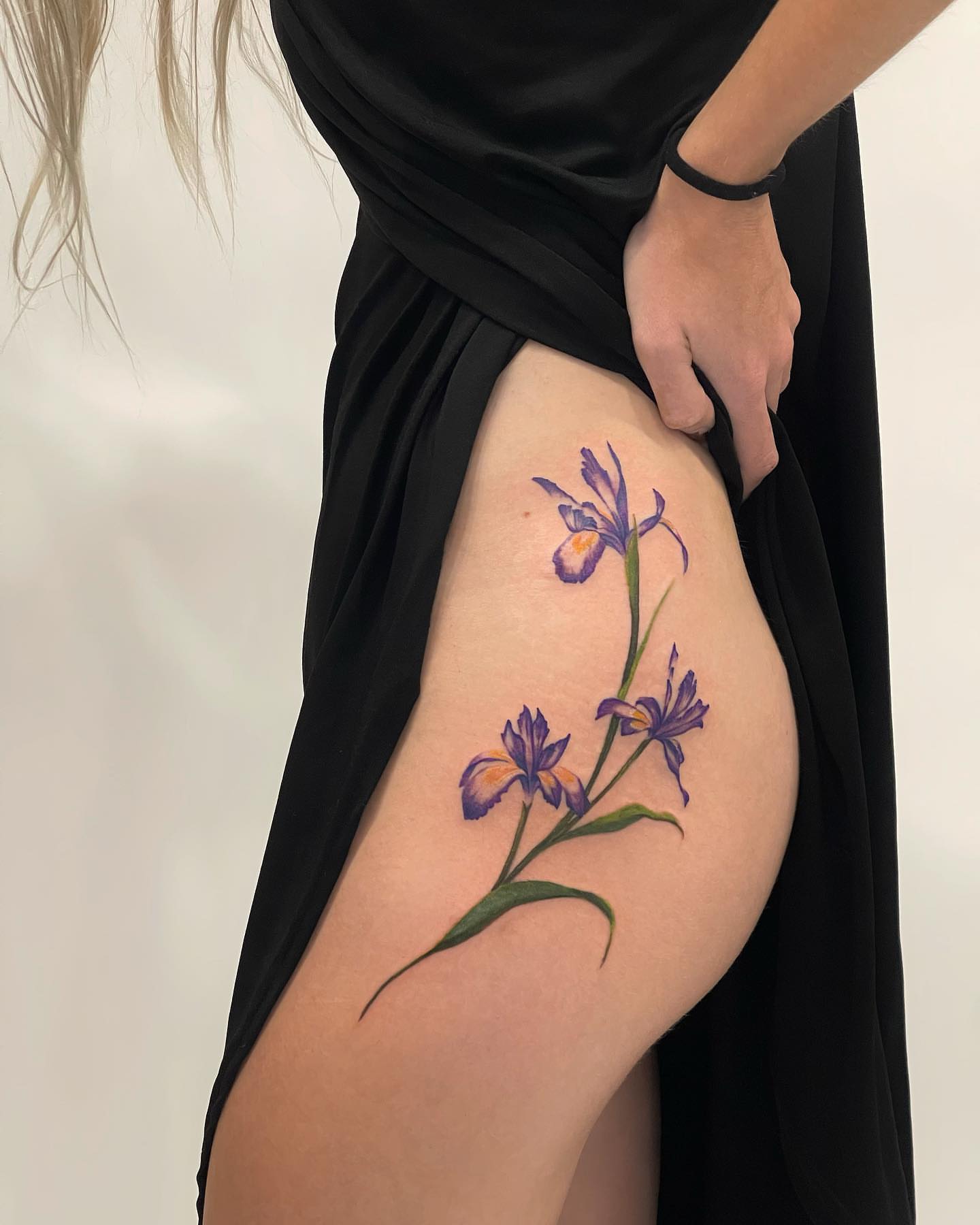 Iris flowers realism tattoo on the thigh by Seattle Tattoo Artist PingPing, Seattle, Washington