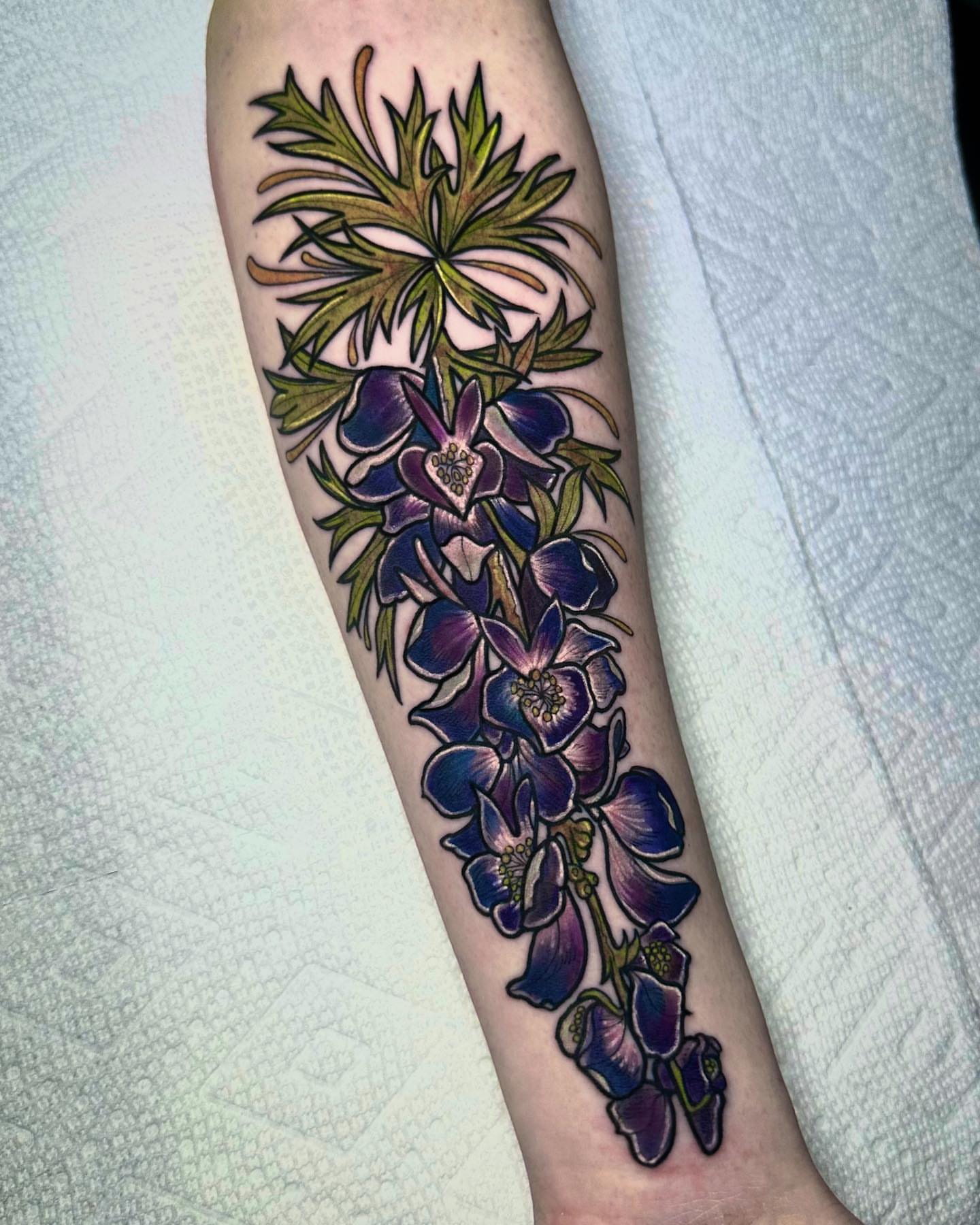 Wisteria flowers new school tattoo on the forearm by Naysla Droguett