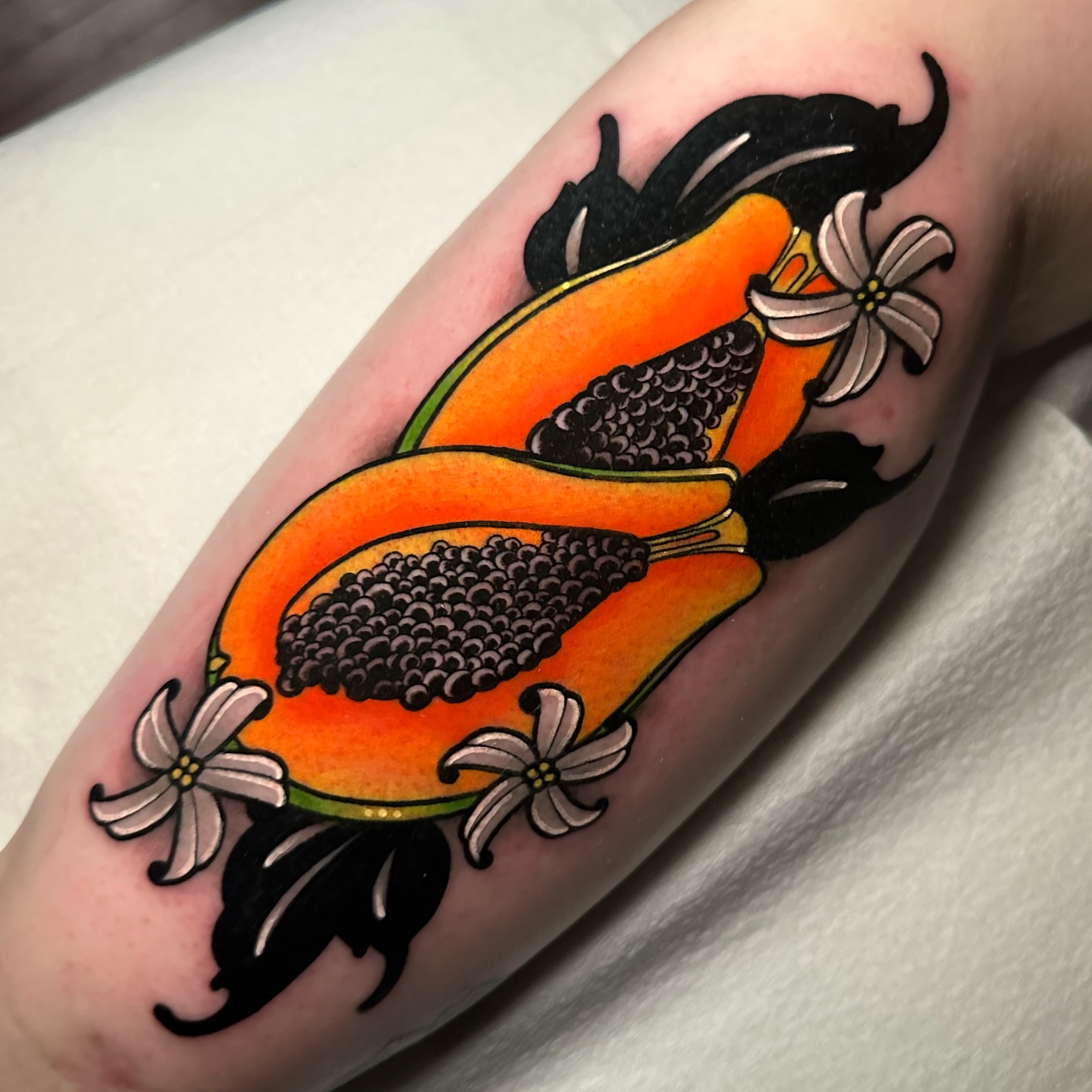 Papaya American traditional tattoo on the forearm by gillian marie
