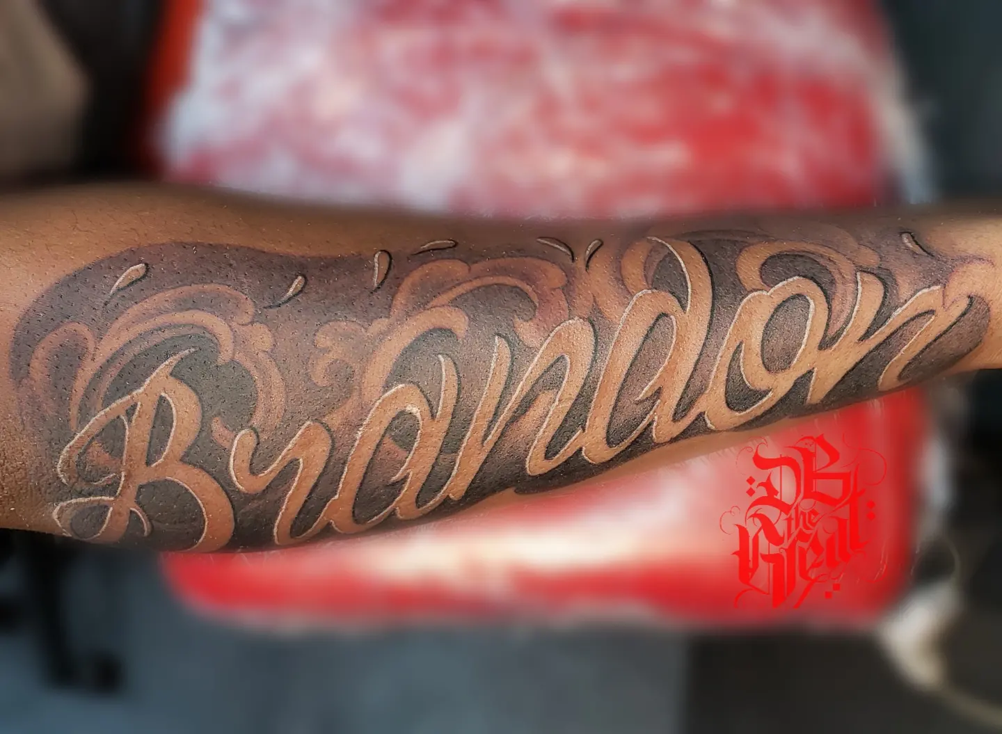 Brandon lettering script tattoo on the forearm by Dannie Blythewood
