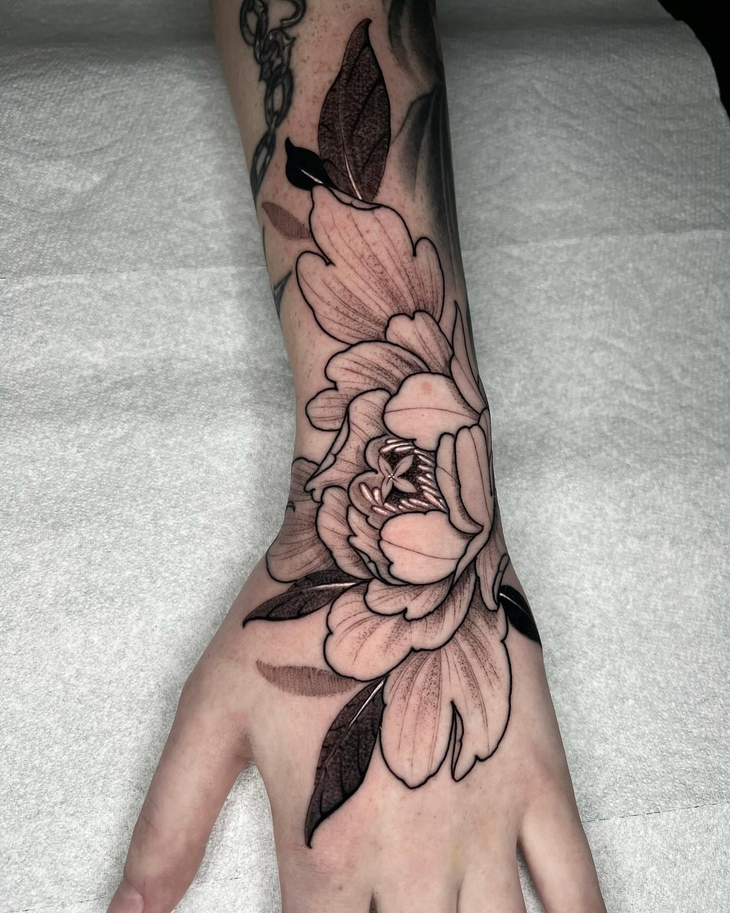 Peony black and grey tattoo on the hand by Angelo Buonanno, Las Vegas, Nevada