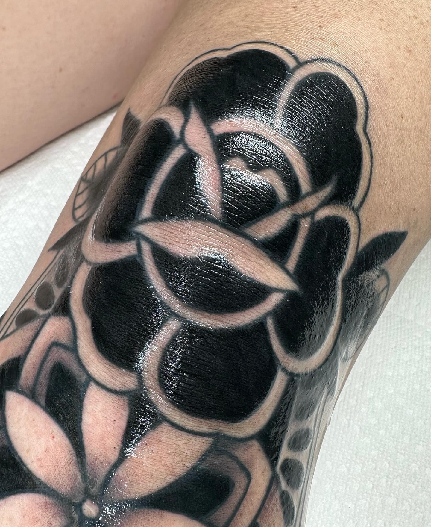 Rose American traditional tattoo on the forearm by Katie Kelley