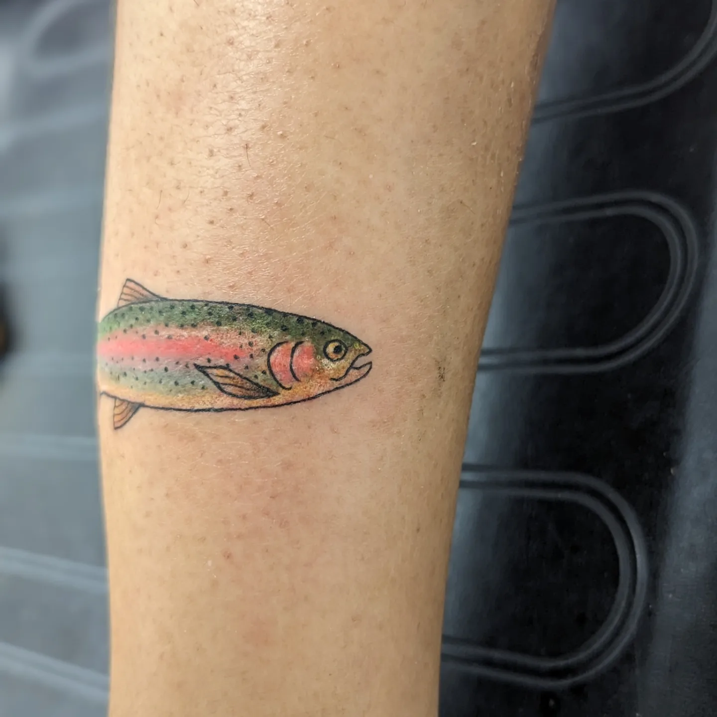 Rainbow trout dotwork tattoo on the forearm by Lorelei
