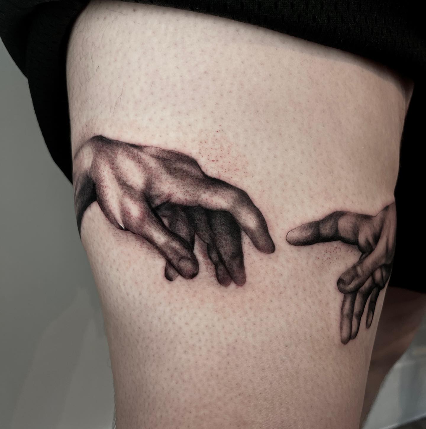 Hands dotwork tattoo on the thigh by Jesse Temores