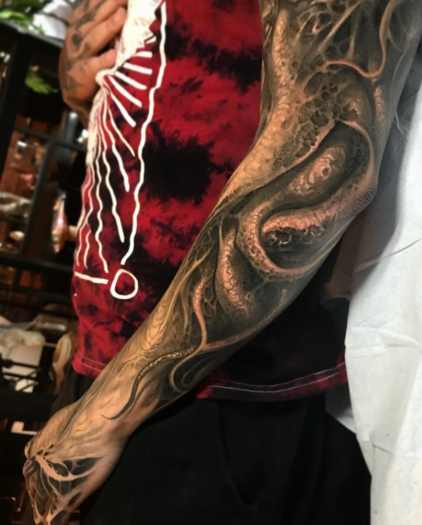 Squid tentacles realism tattoo on the forearm by Brandon Herrera