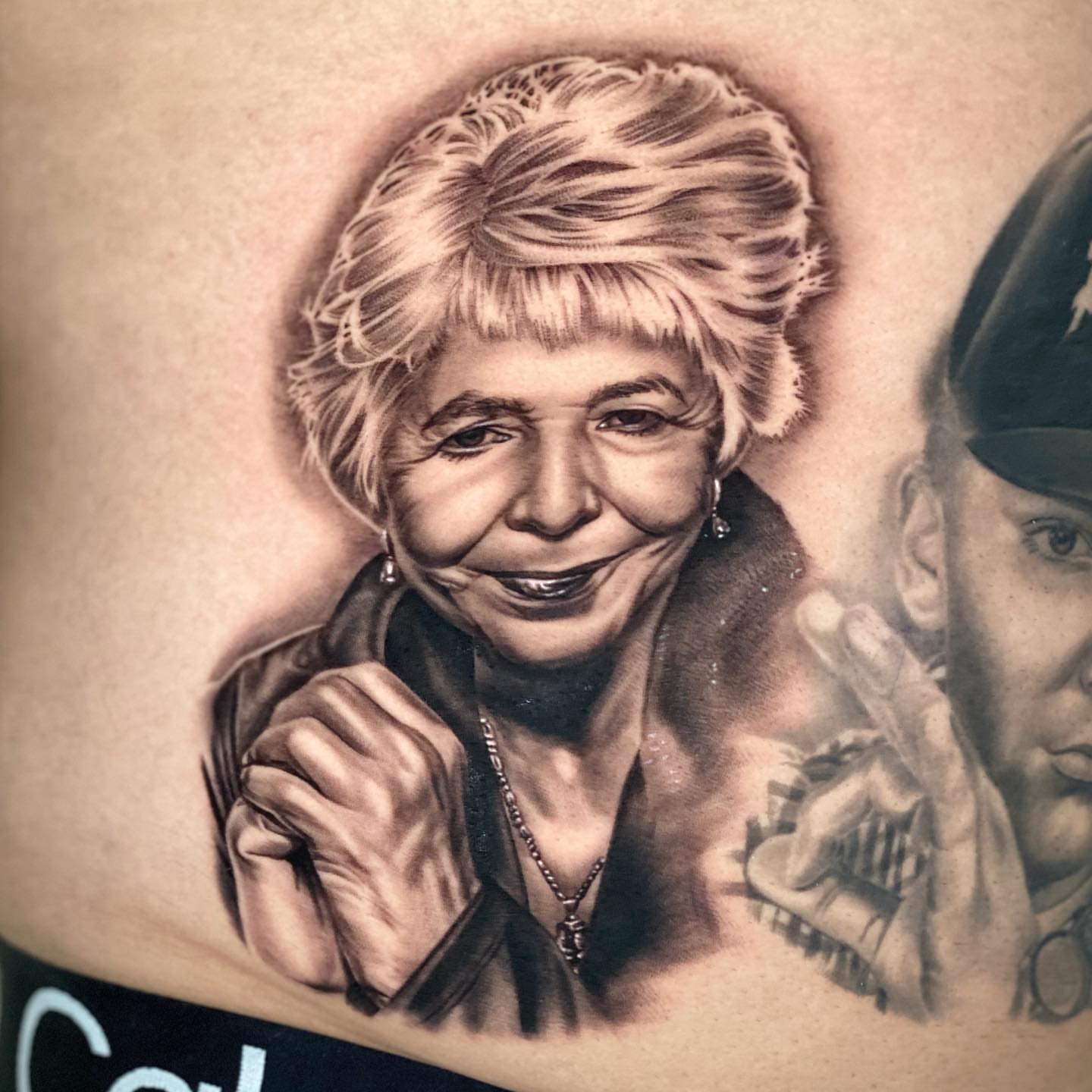 Portrait realism tattoo on the thigh by Sergio Mendez