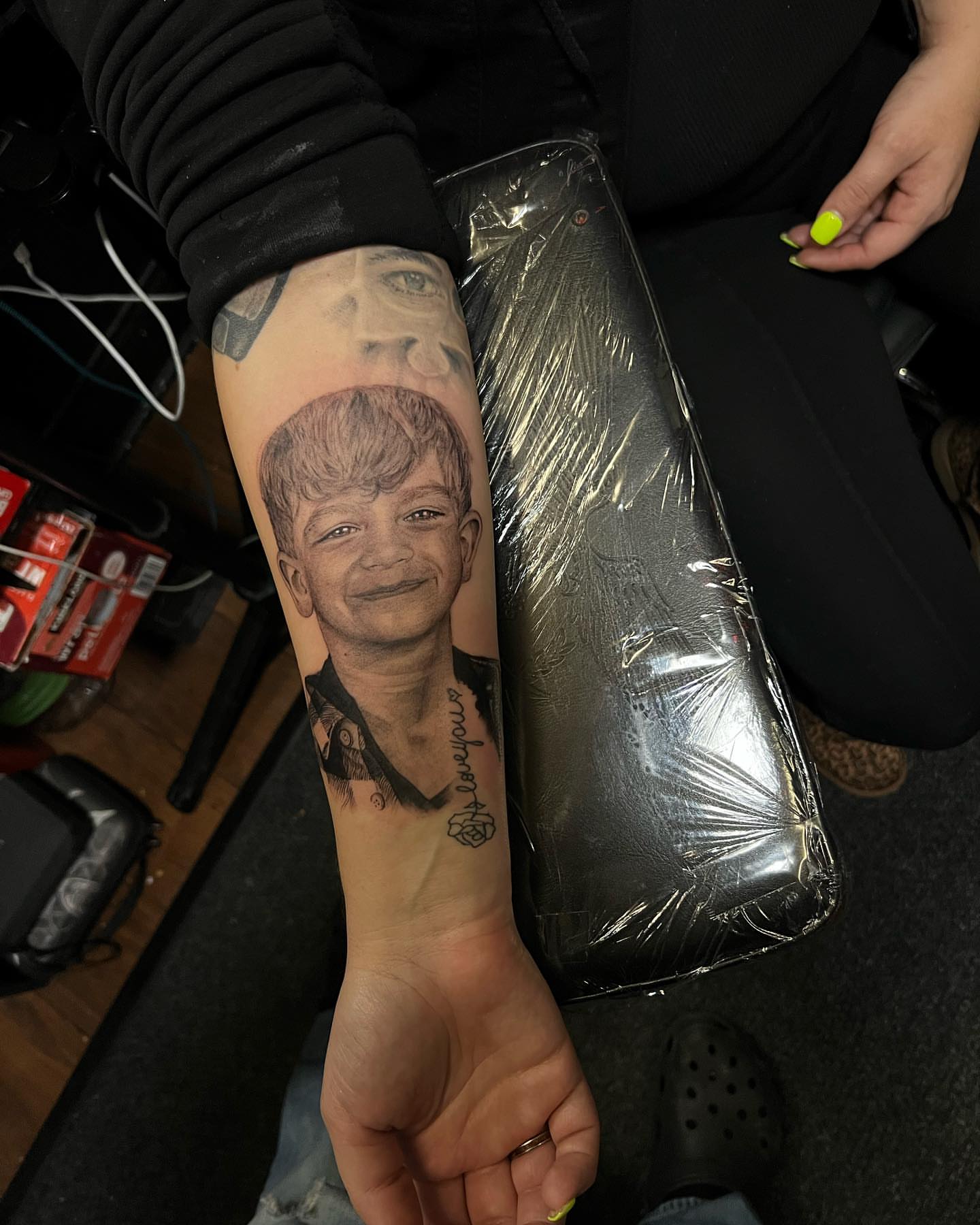 Child portrait realism tattoo on the forearm by JT Ink