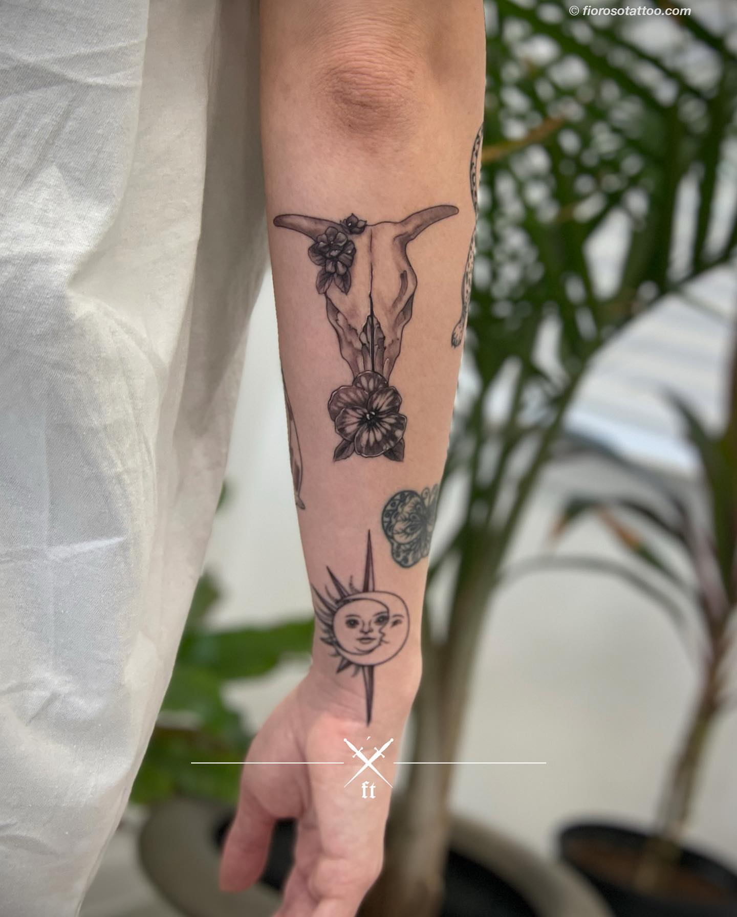 Bull skull and flowers black and grey tattoo on the forearm by Jonathan Paul Fiore, Austin, Texas