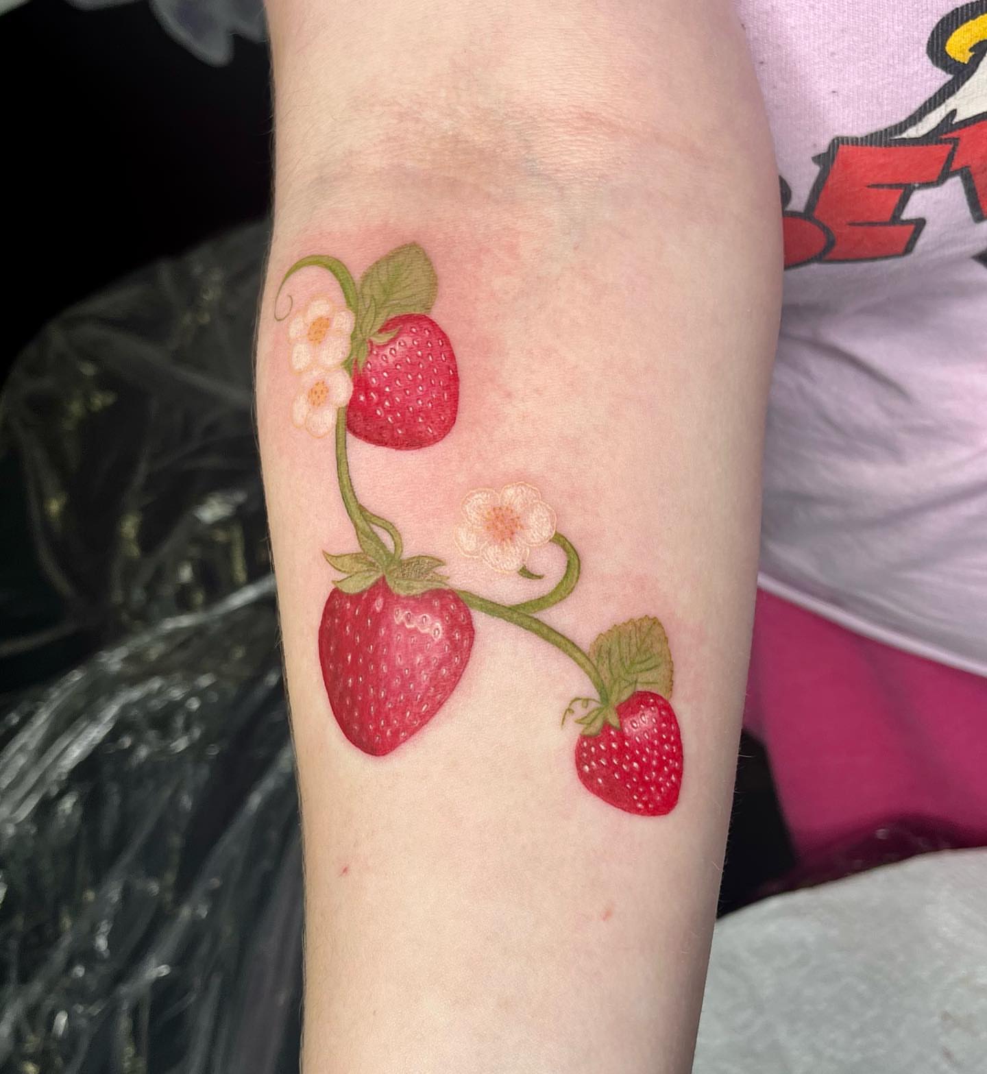 Strawberries and flowers realism tattoo on the forearm by 𝖎𝖘𝖆 ✶ 𝖉𝖋𝖜 𝖙𝖆𝖙𝖙𝖔𝖔𝖘