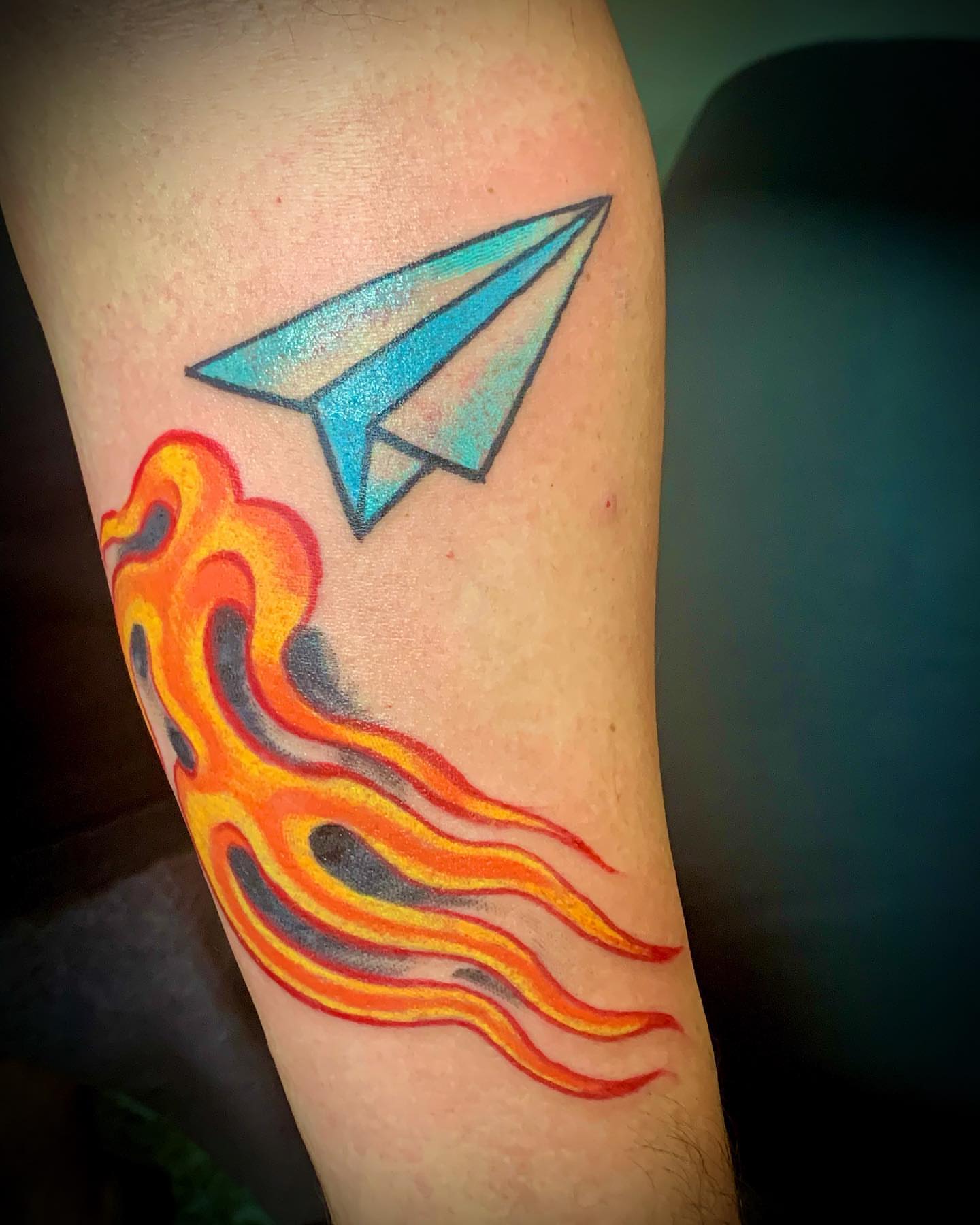 Paper airplane geometric tattoo on the forearm by @colorrobbie