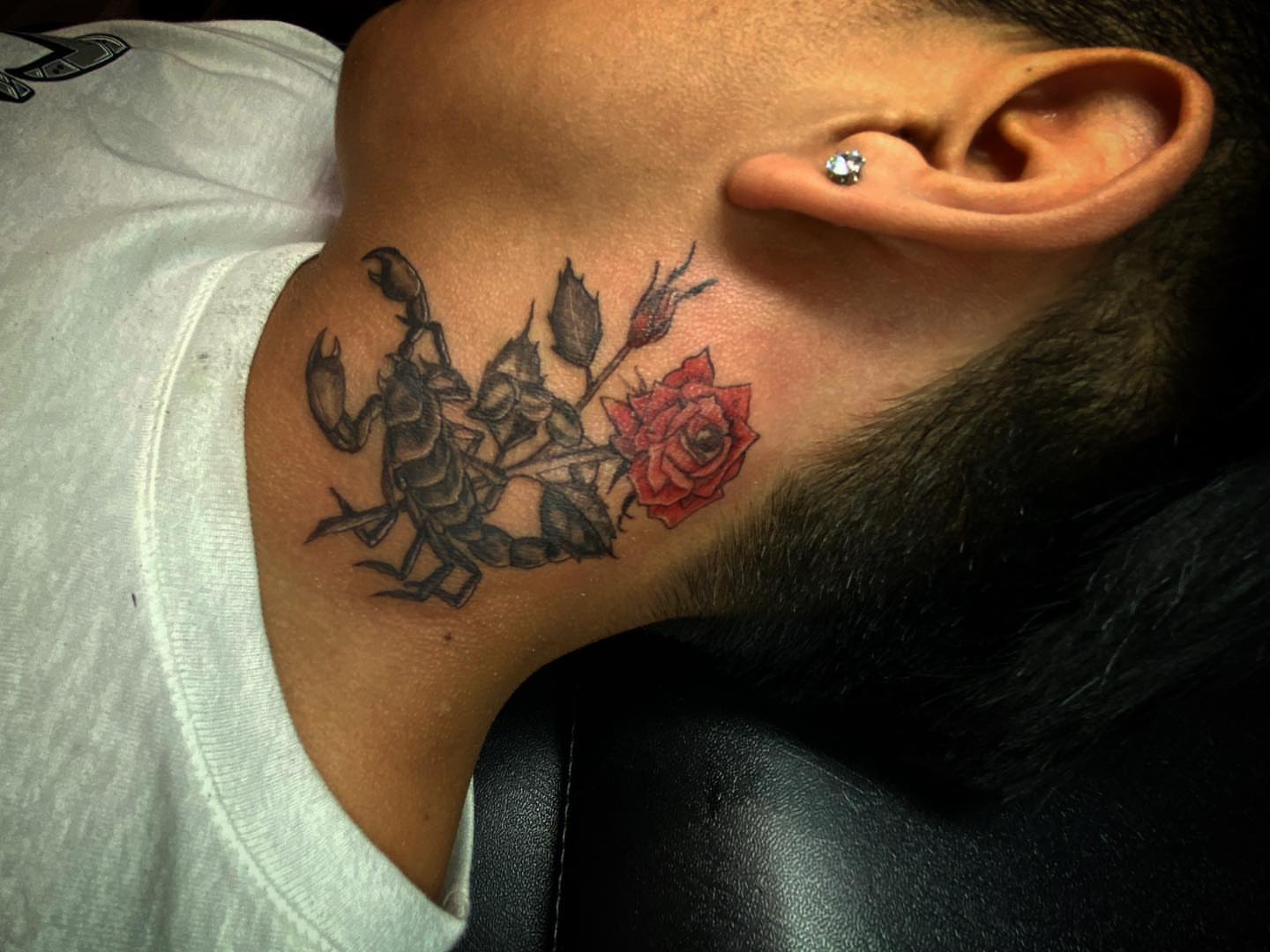 Scorpion and roses realism tattoo on the neck by Erasmo Vasquez