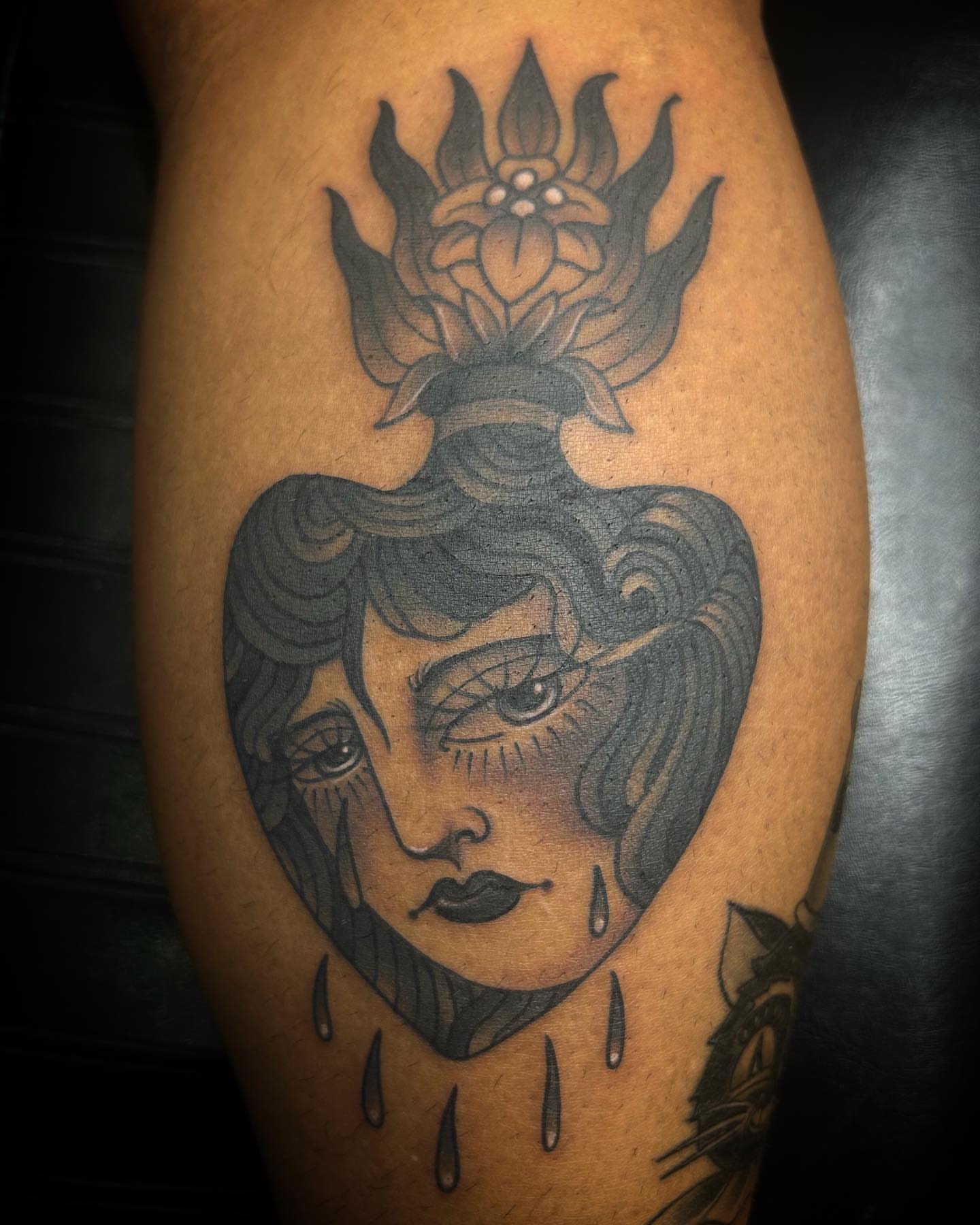 Woman's face with flower crown American traditional tattoo on the forearm by Samantha C, Bremerton, Washington