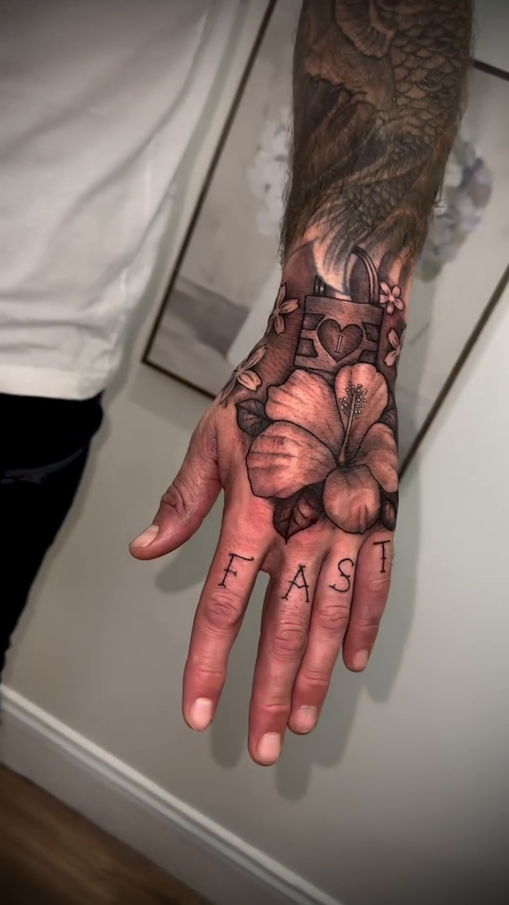 Hibiscus flowers and lettering realism tattoo by Tim Faulkner