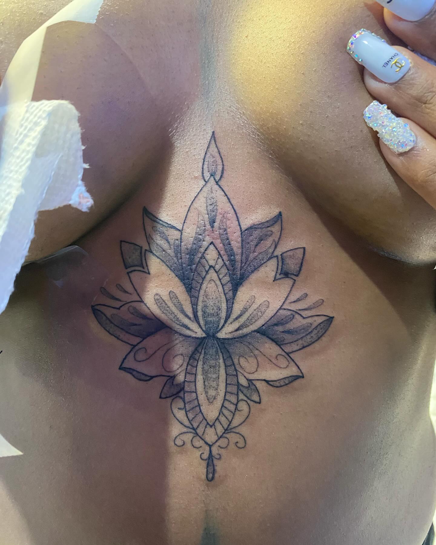 Lotus flower geometric tattoo on the ribs by 2realink - Tattoo Artist