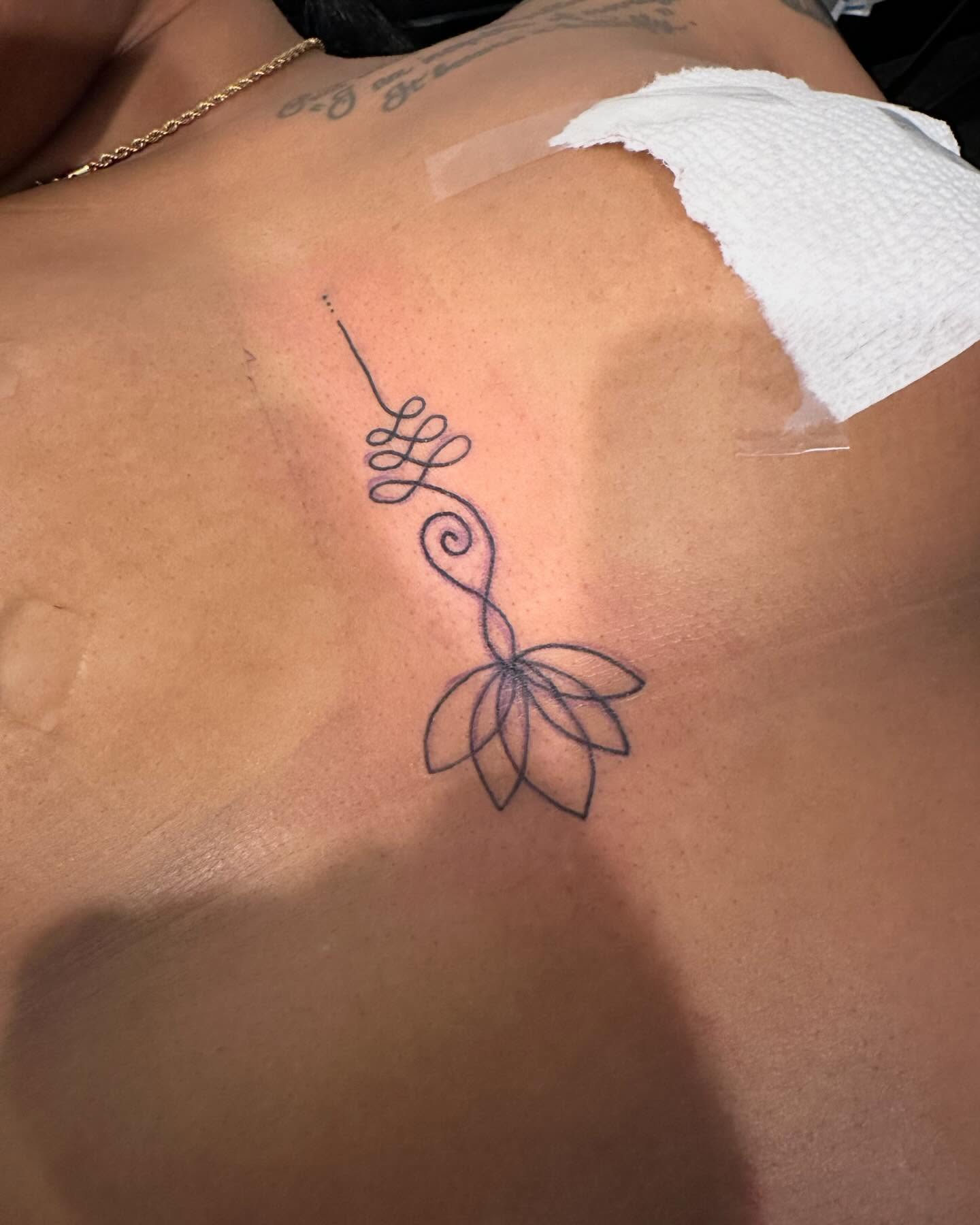 Lotus flower fine line tattoo on the back by 2realink - Tattoo Artist