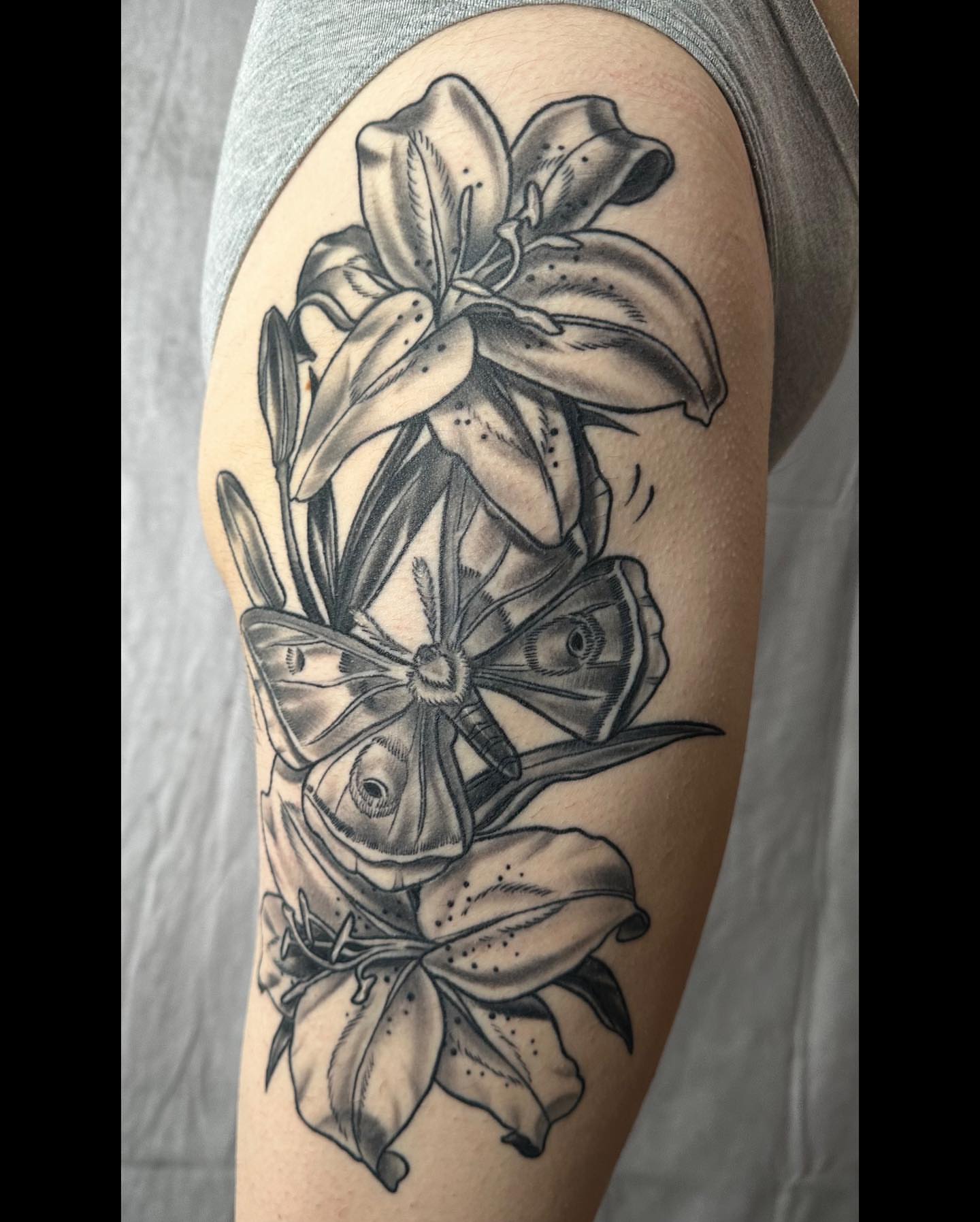 Lilies and butterfly realism tattoo on the forearm by ✨Sarah Knapp✨, Eugene, Oregon