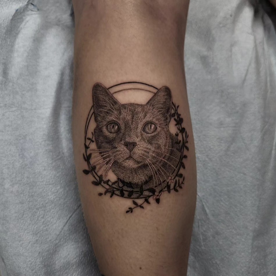 Cat dotwork tattoo on the forearm by Kyle Joseph [tattoo artist]