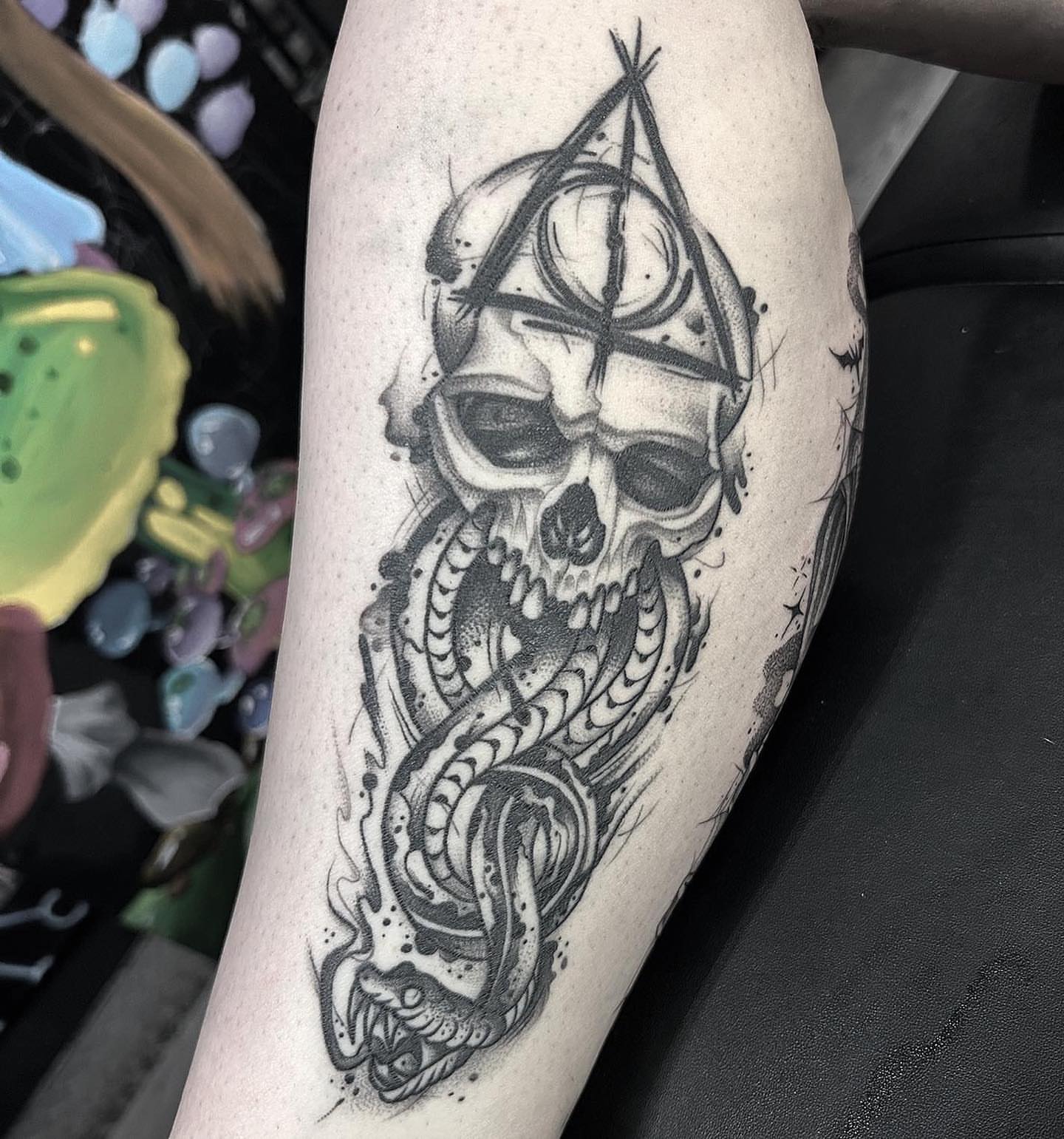 Skull with symbols dotwork tattoo on the forearm by Anna Nicole Thomas