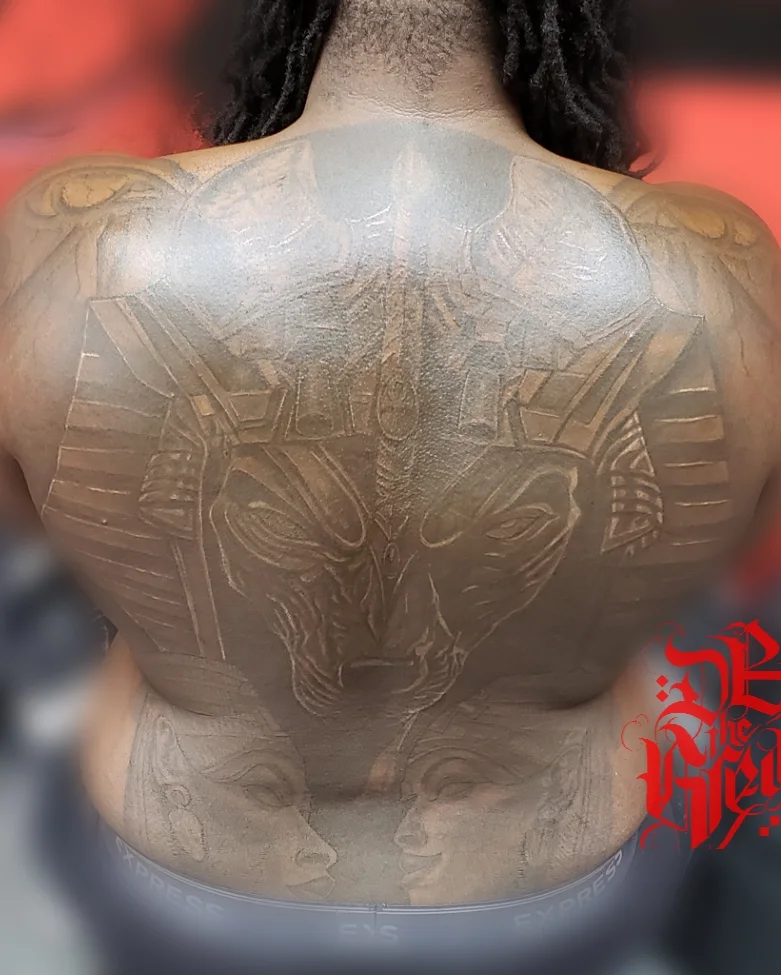 Lion geometric tattoo on the back by Dannie Blythewood