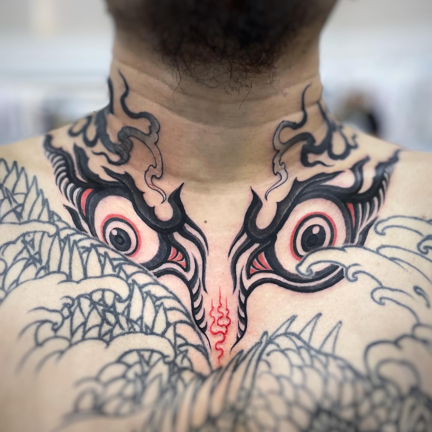 Demon eyes japanese irezumi tattoo on the chest by Scienz 九卦刺青