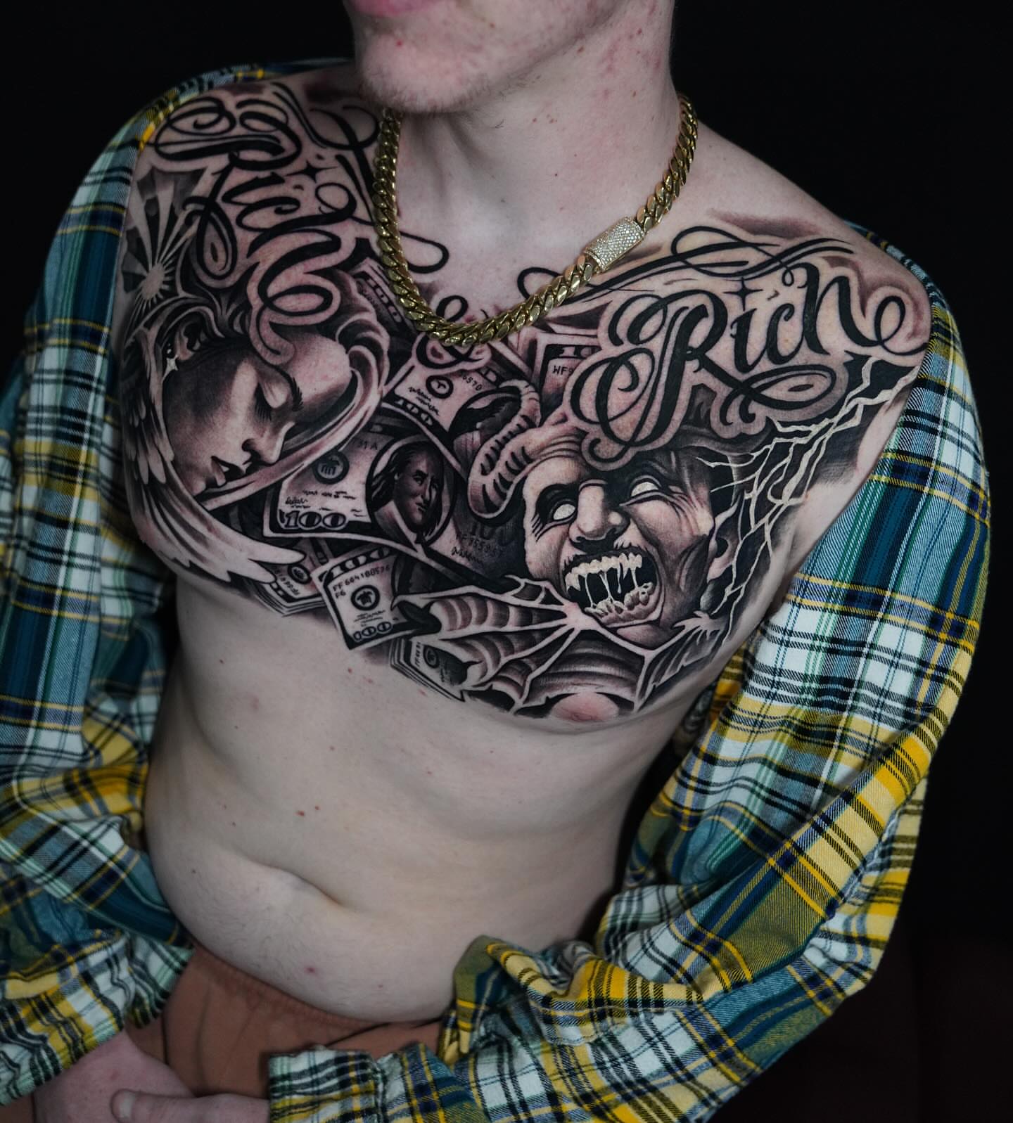 Money and faces realism tattoo on the chest by Artem Kunakuzin
