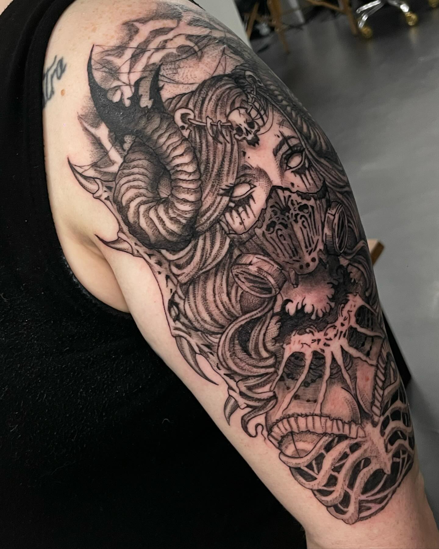 Ram skull and woman realism tattoo on the forearm by Kathryn the Tooth Collector