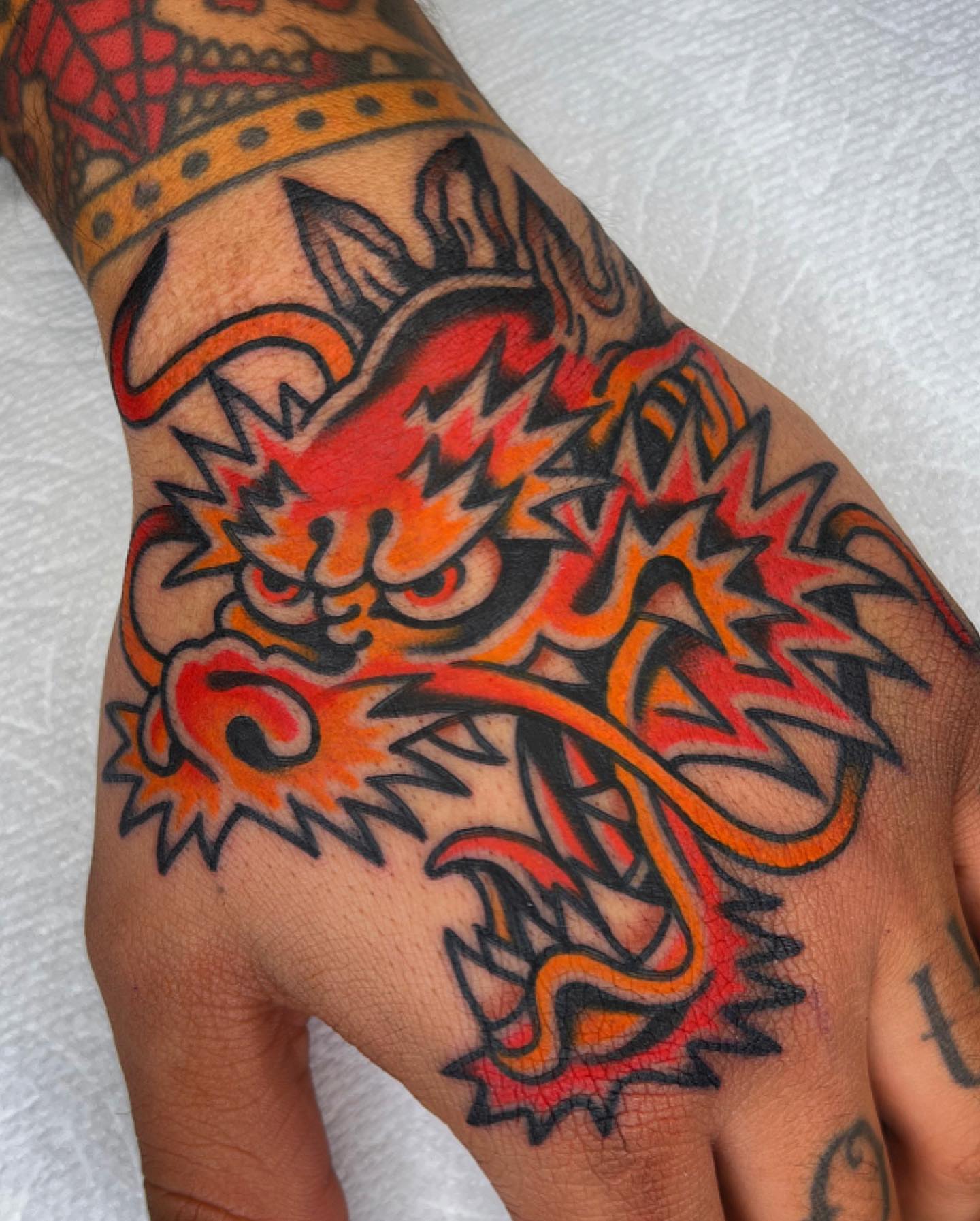 Dragon American traditional tattoo on the hand by Arturo Ledesma