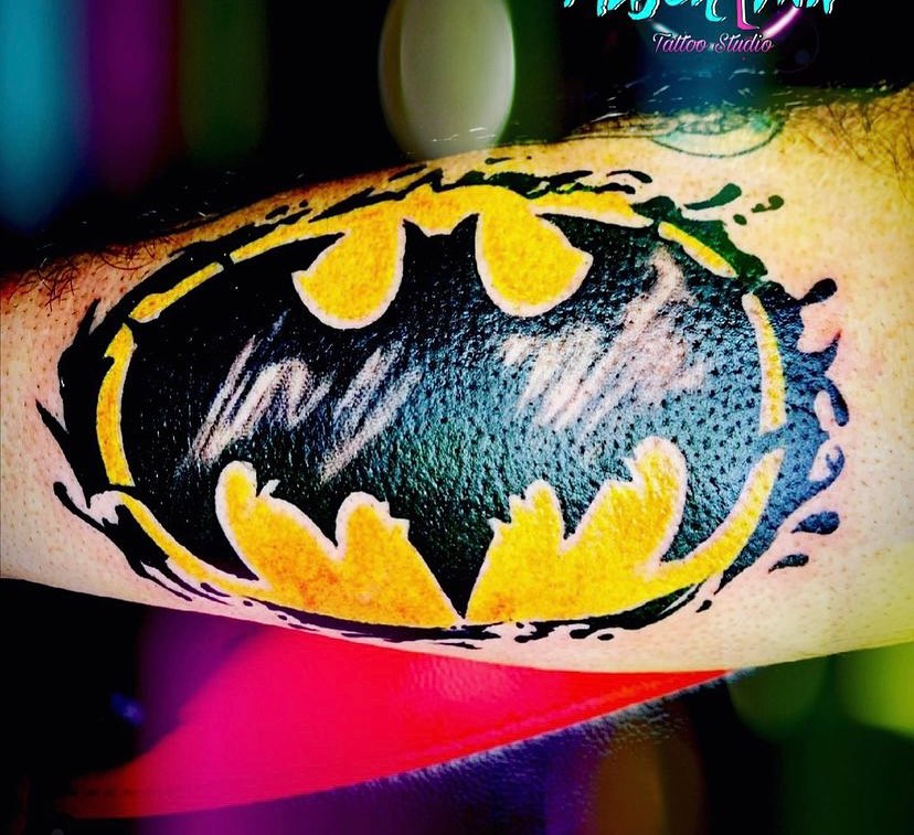 Batman logo dotwork tattoo on the forearm by @colorrobbie