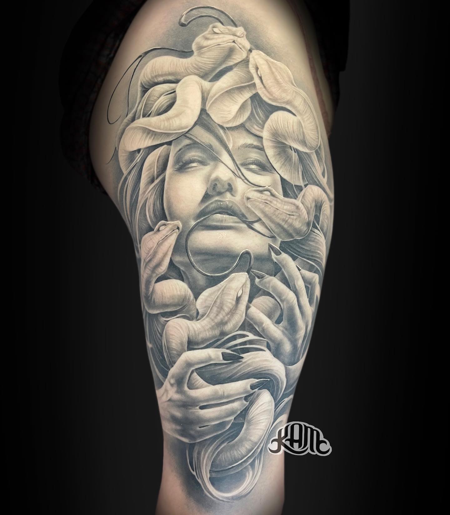 Woman with calla lilies realism tattoo on the forearm by Keith (KAM) Miller