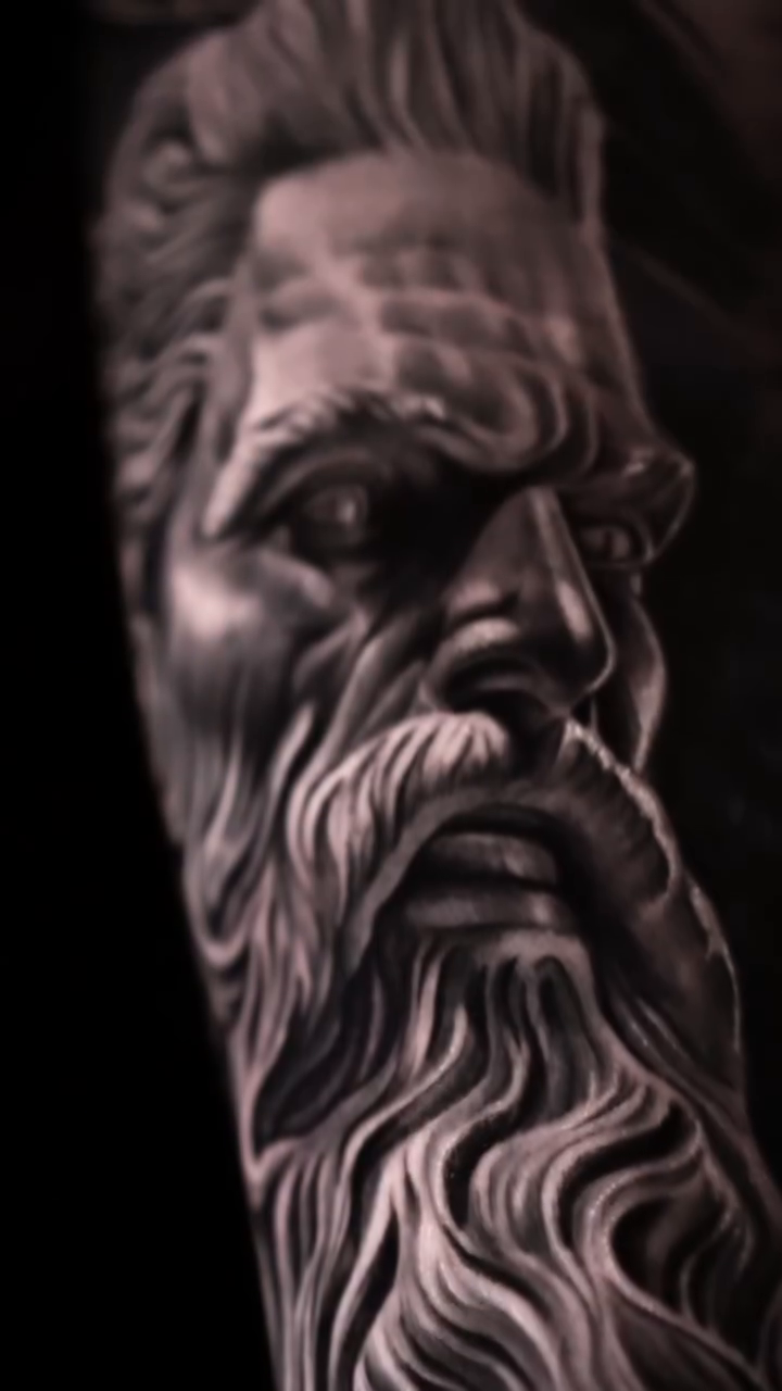 Bust of a bearded man realism tattoo by Luis Bravo