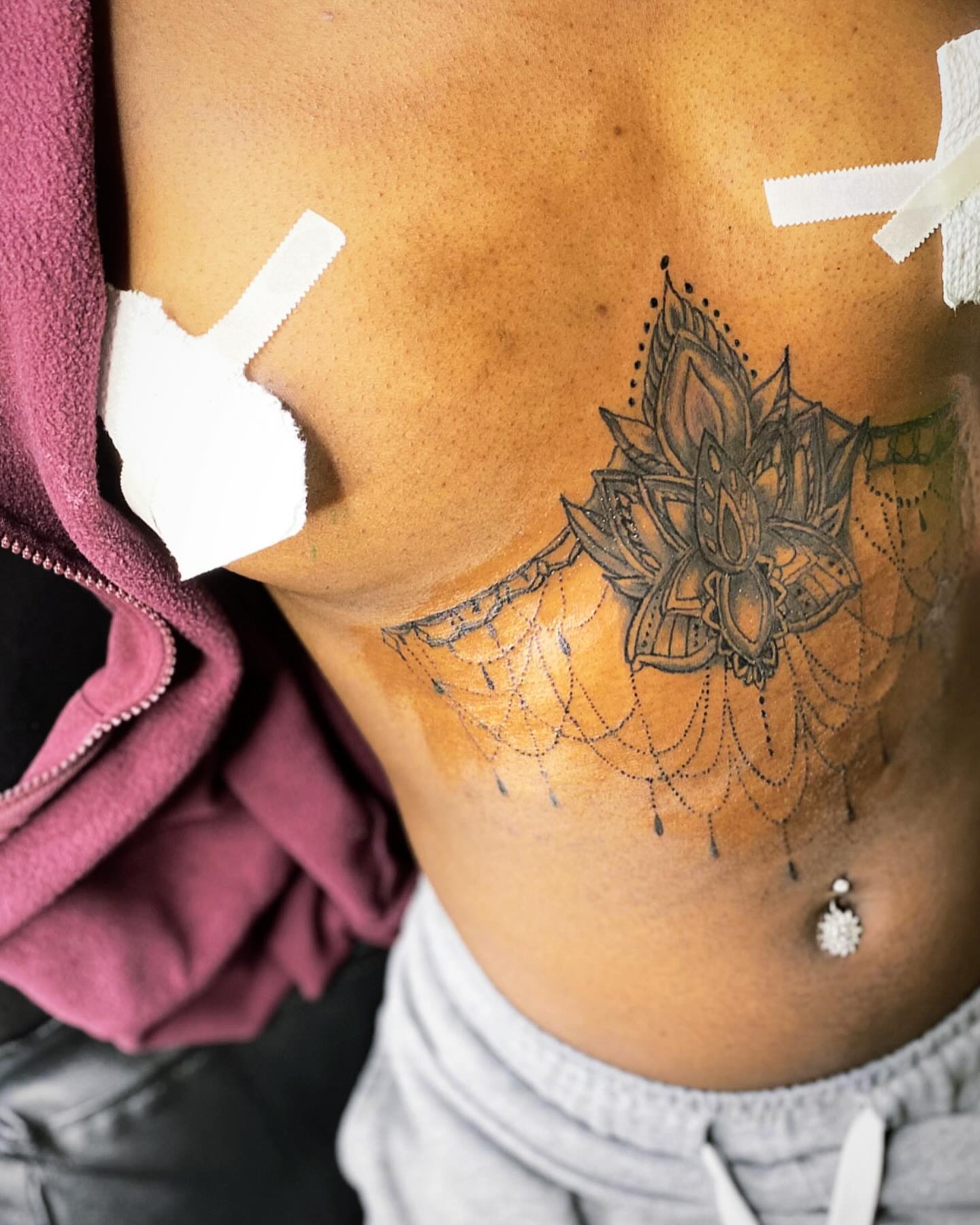Lotus flower dotwork tattoo on the ribs by Rell Washington, Marlow Heights, Maryland