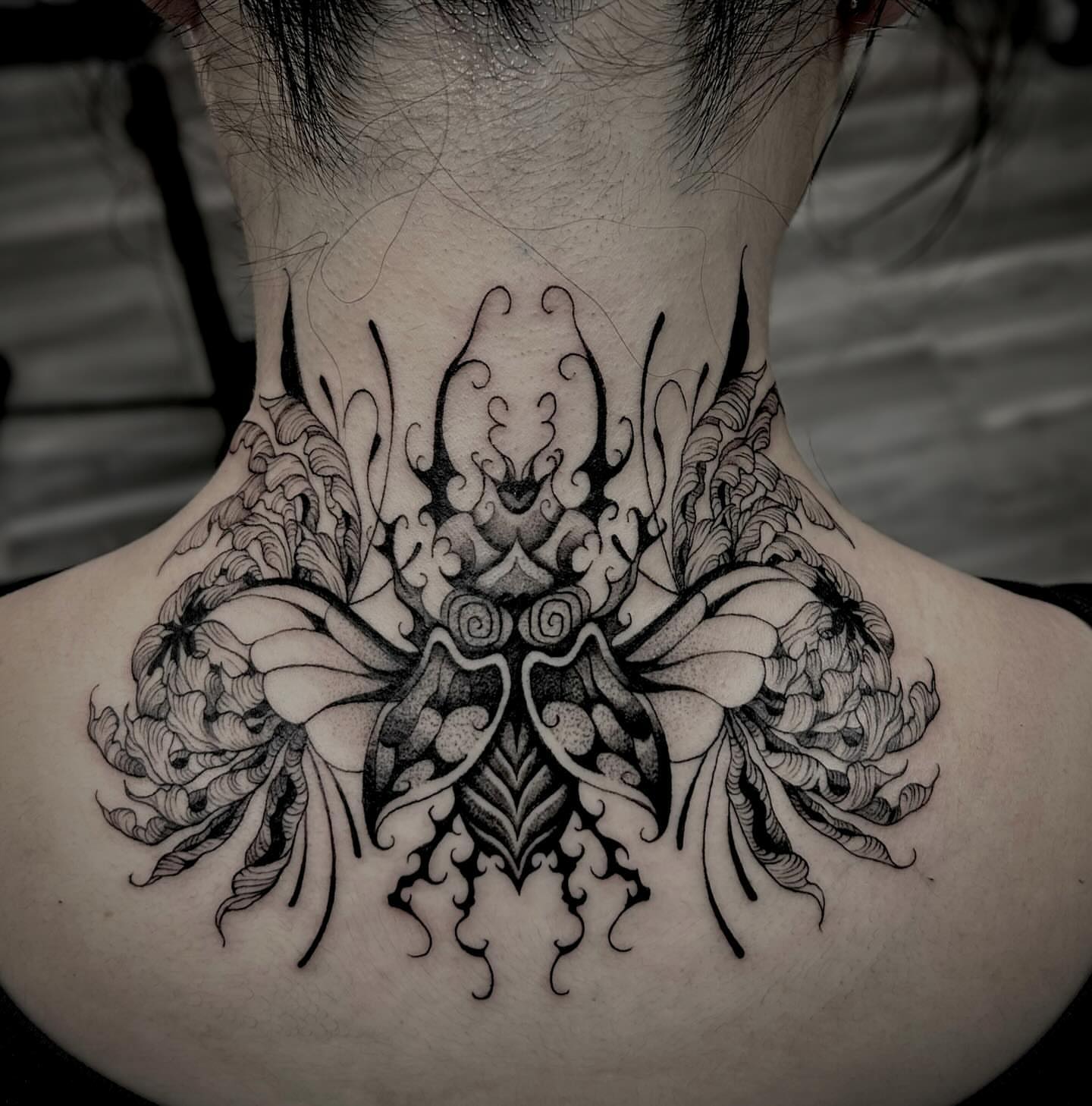 Floral mandala ornamental tattoo on the neck by Melanie