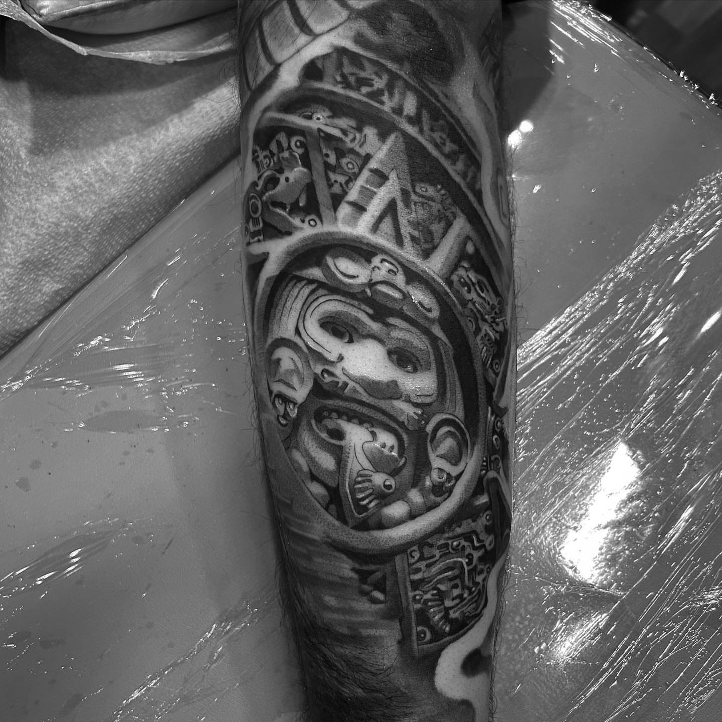 Mayan calendar geometric tattoo on the forearm by Alex Cruz 707