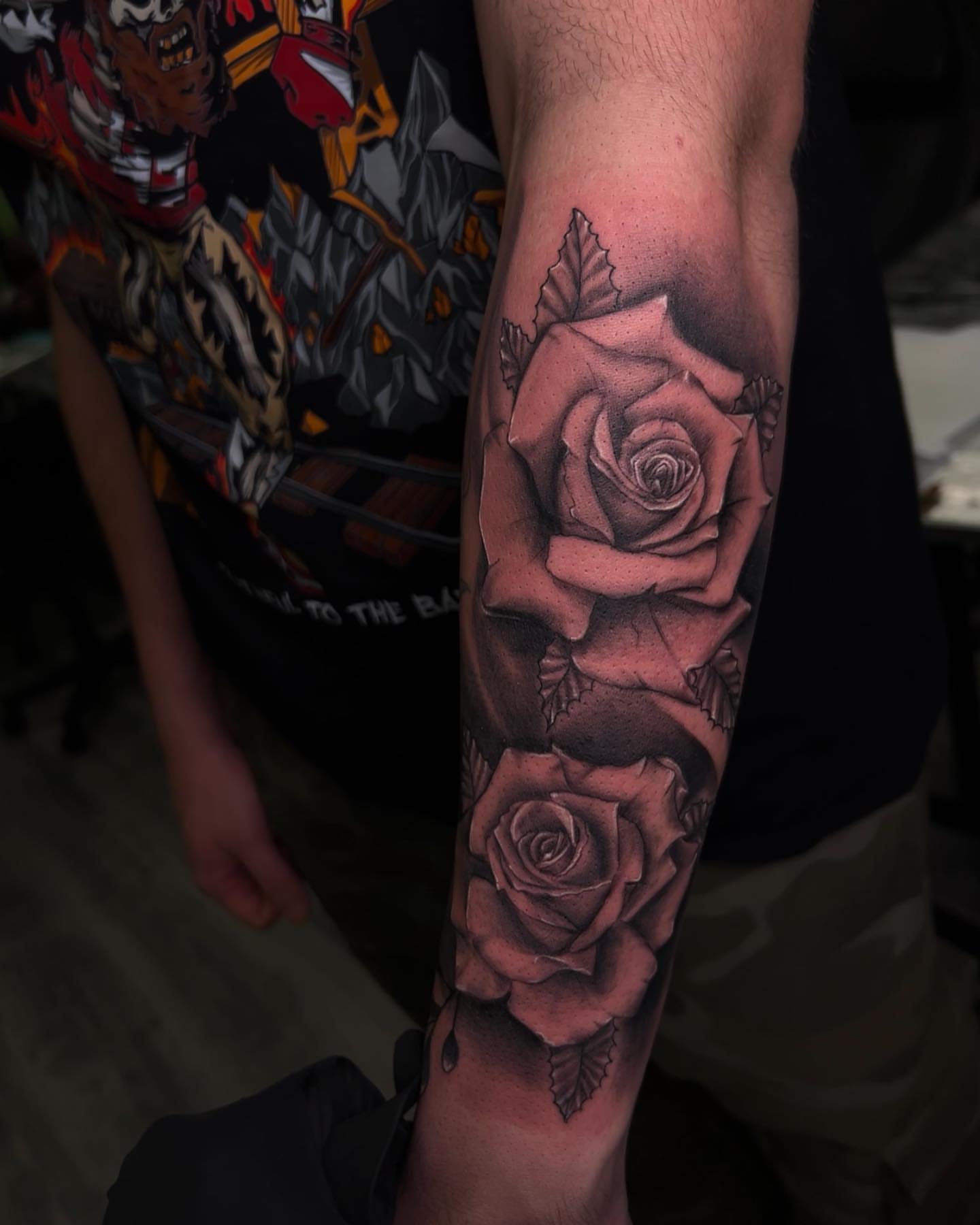 Roses realism tattoo on the forearm by Tattoo Artist