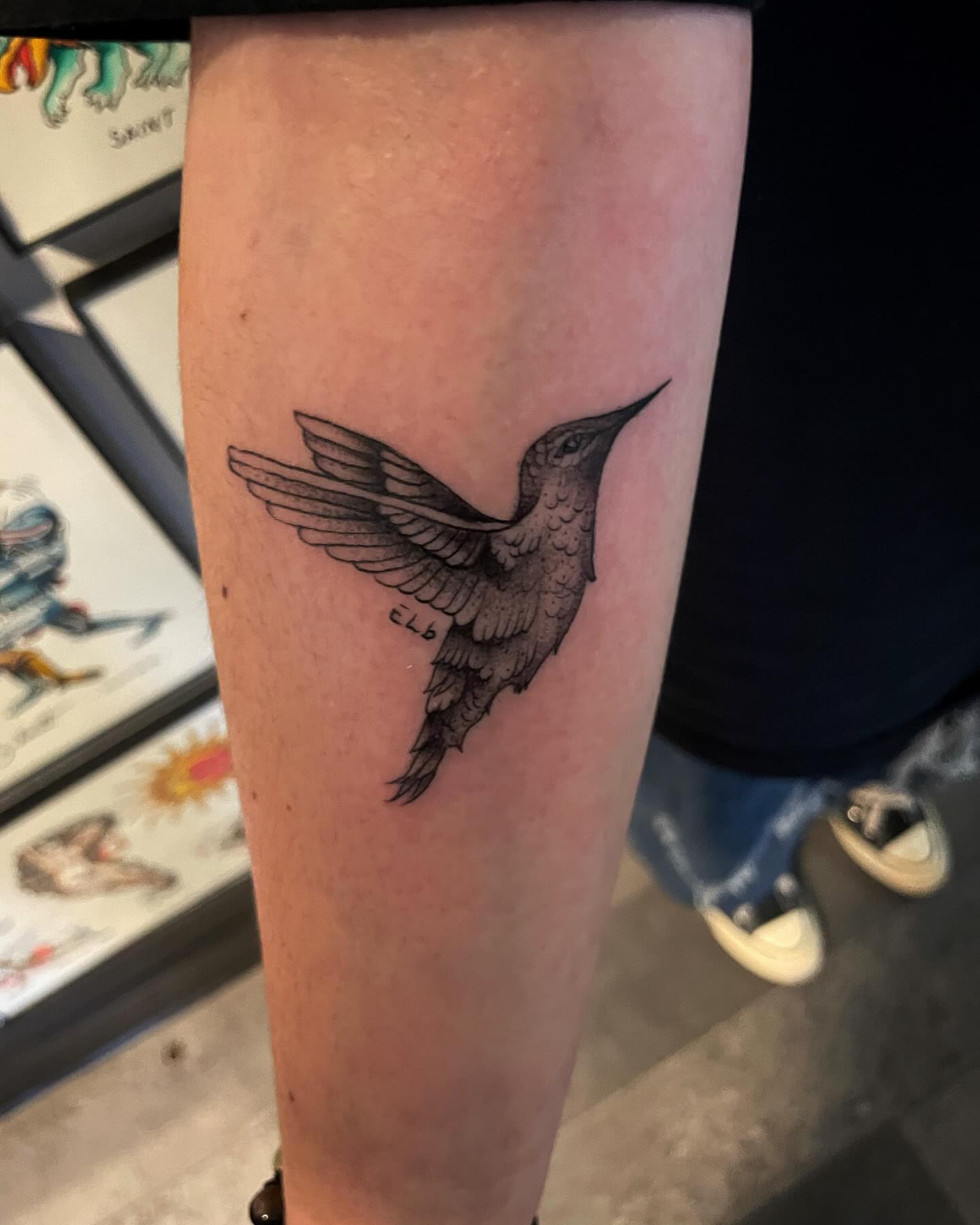 Hummingbird black and grey tattoo on the forearm by Kimberly Shordon