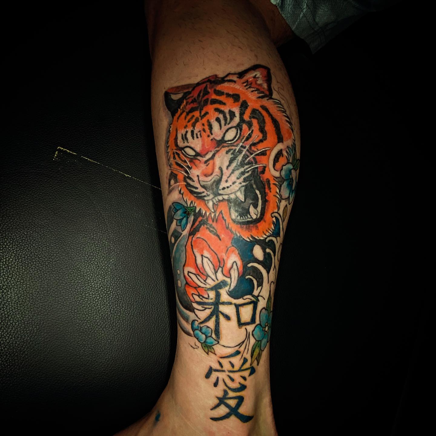Tiger American traditional tattoo on the forearm by Erasmo Vasquez