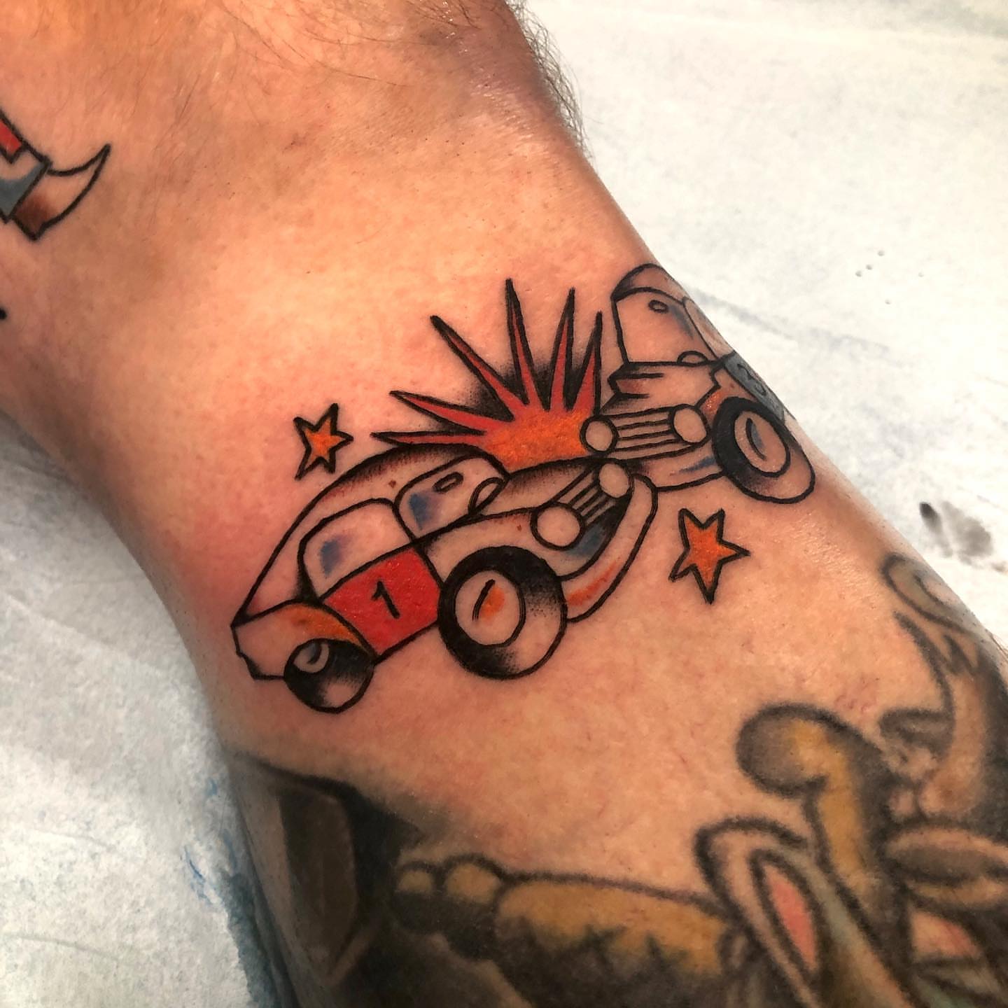 Race car American traditional tattoo on the forearm by brenden