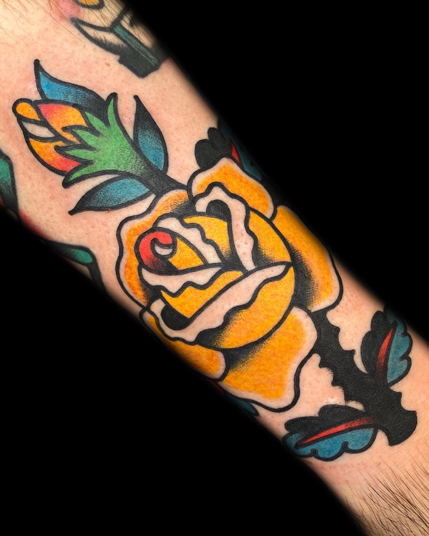Yellow rose American traditional tattoo on the forearm by The Calamari Kid
