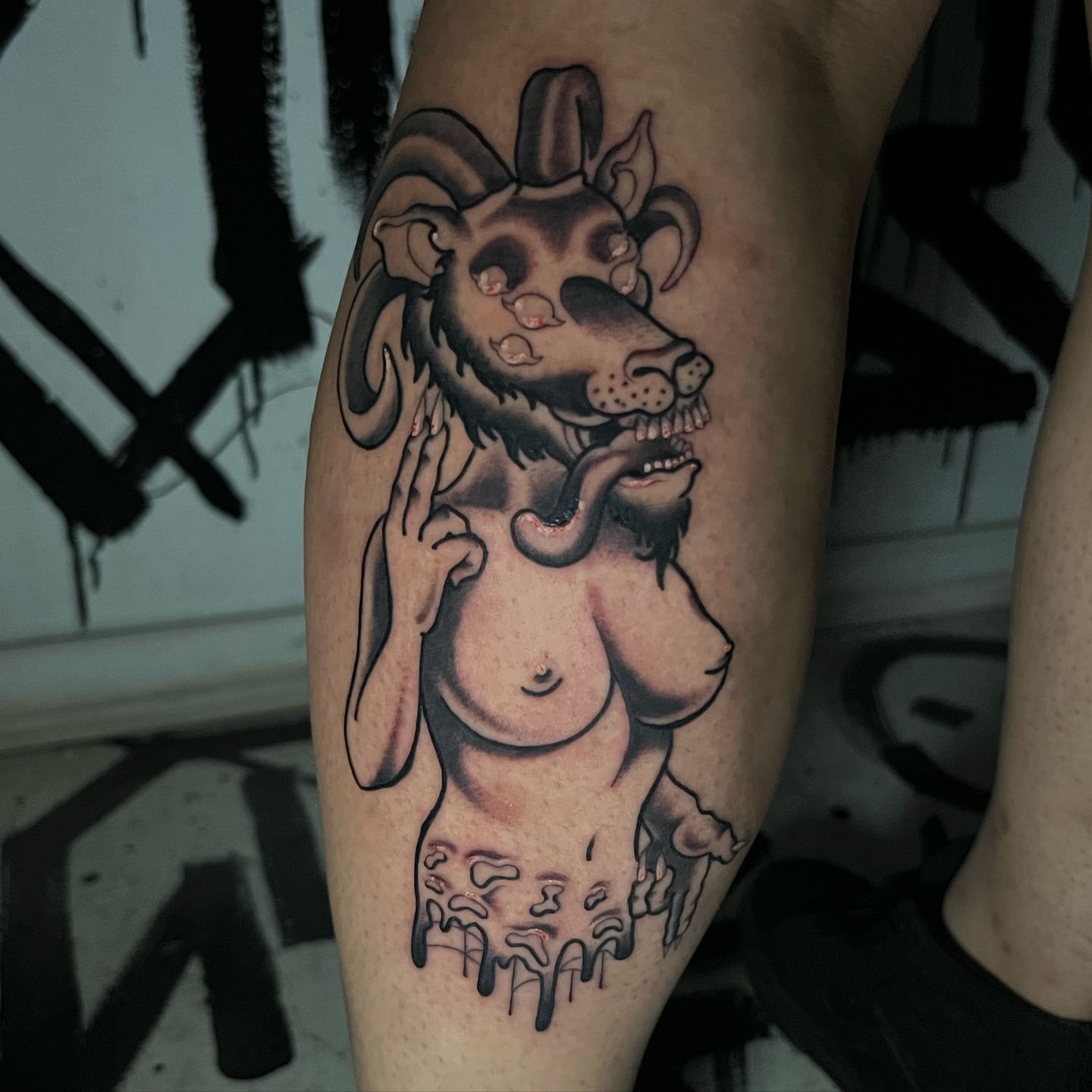 Demon dark realism tattoo on the thigh by Brittney
