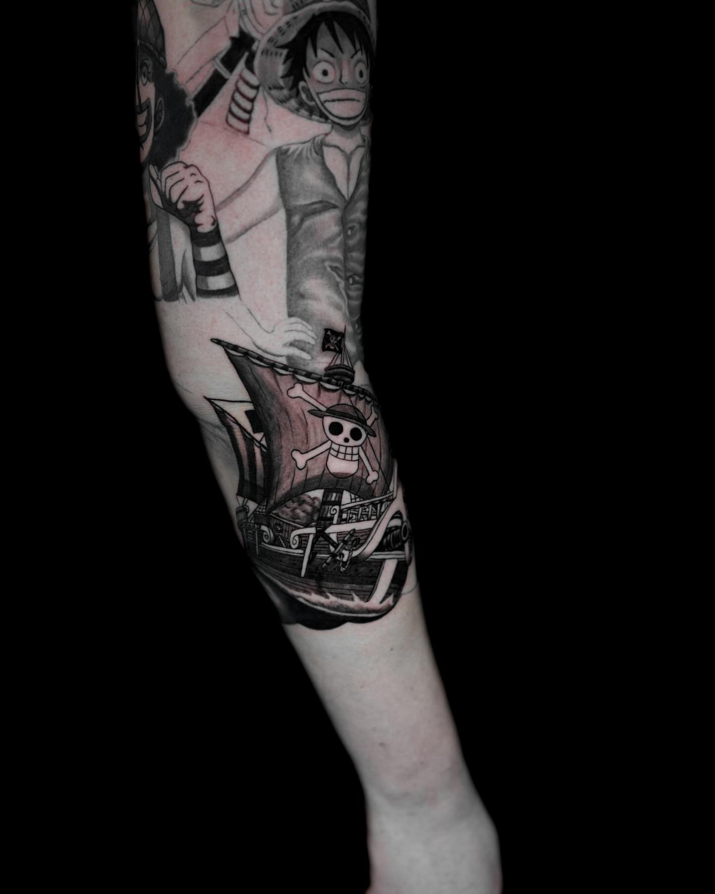 Pirate ship and crew realism tattoo on the forearm by Tattoo Artist
