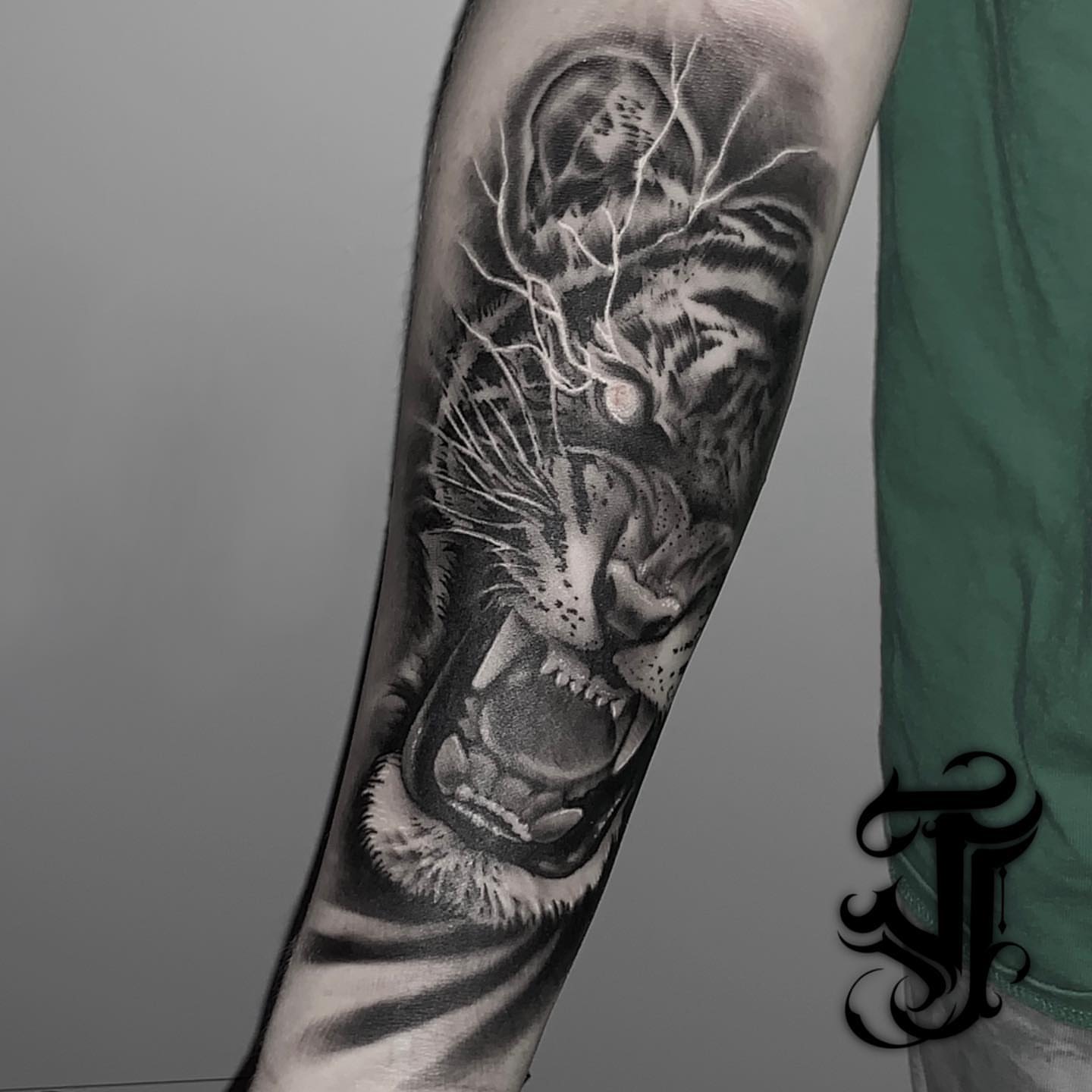 Tiger realism tattoo on the forearm by Justin James