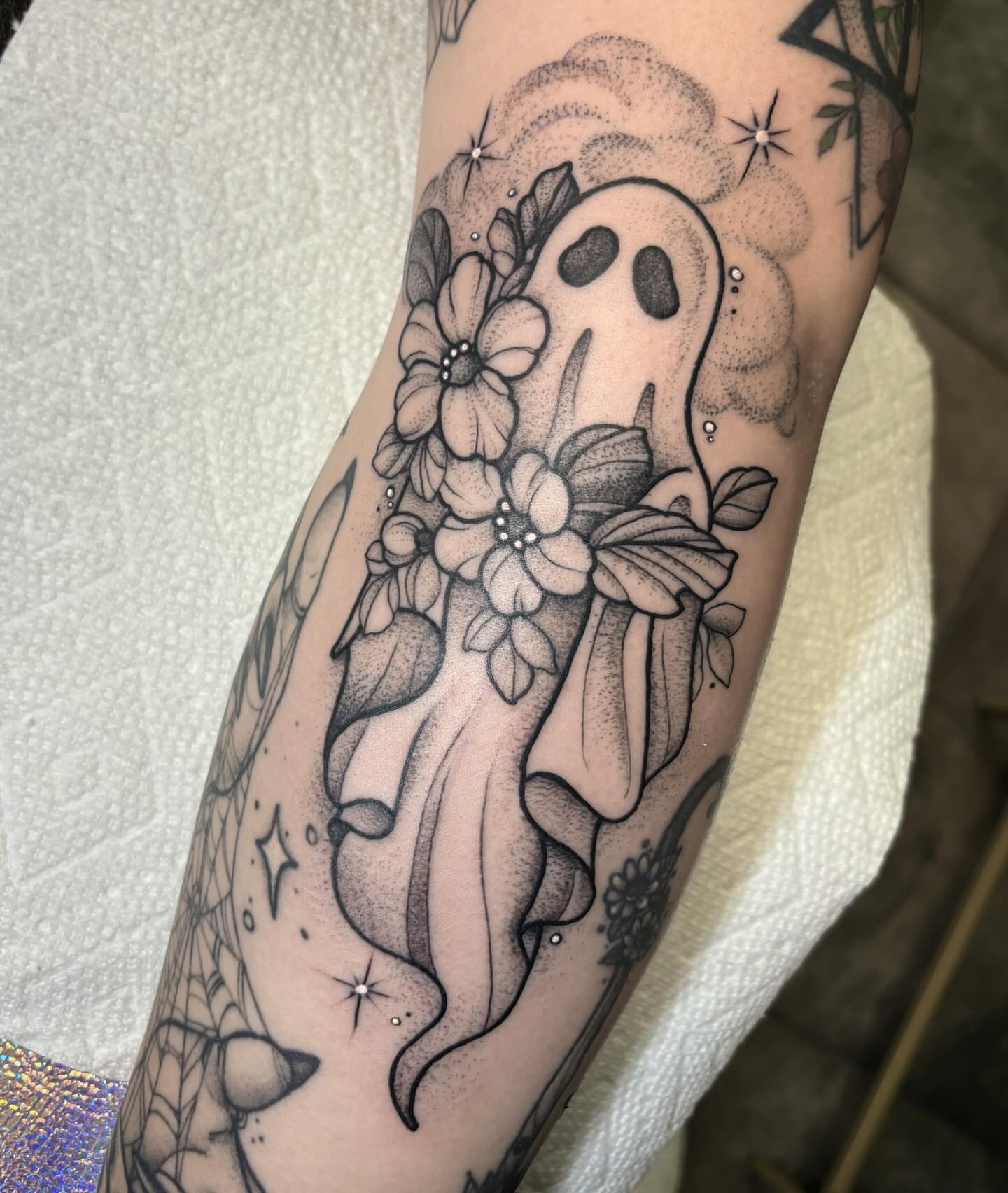 Ghost with flowers dotwork tattoo on the forearm by 𝐀𝐘𝐀𝐍𝐀𝐇