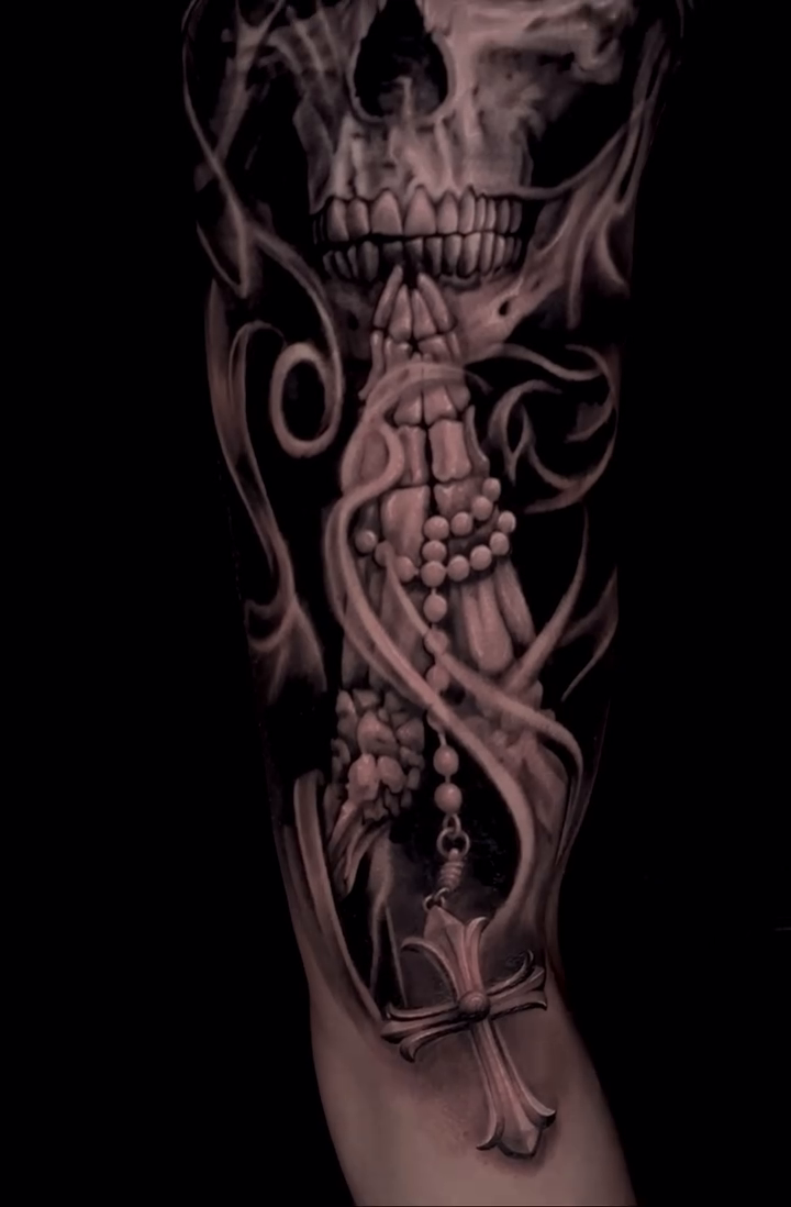 Skull and rosary dark realism tattoo by Sean Flood