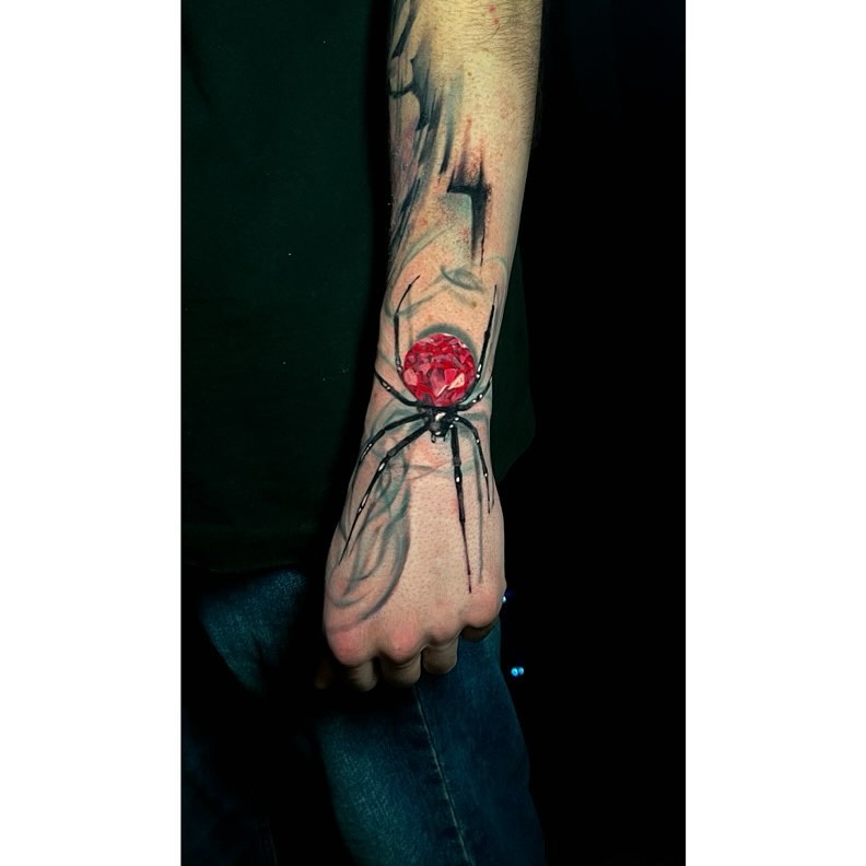 Spider and rose realism tattoo on the forearm by Travis Thorpe