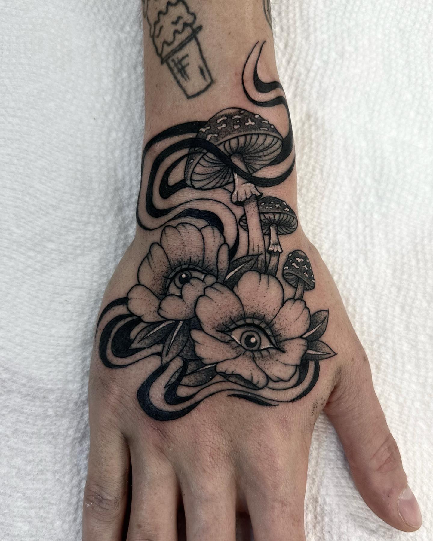 Mushroom and flower dotwork tattoo on the hand by Sierra Hiddleson- Phoenix Arizona Tattoo