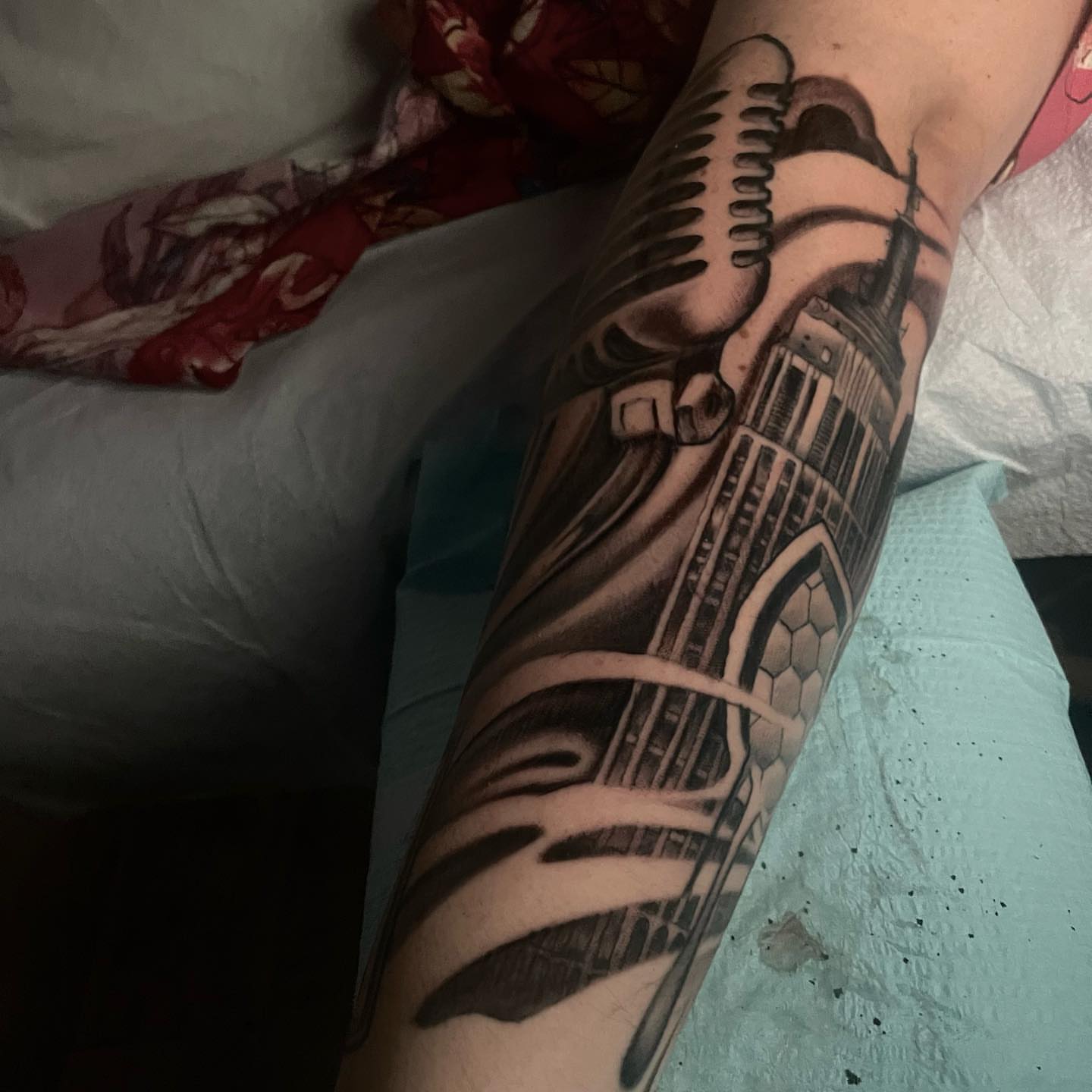 Cityscape geometric tattoo on the forearm by Alex Rockoff