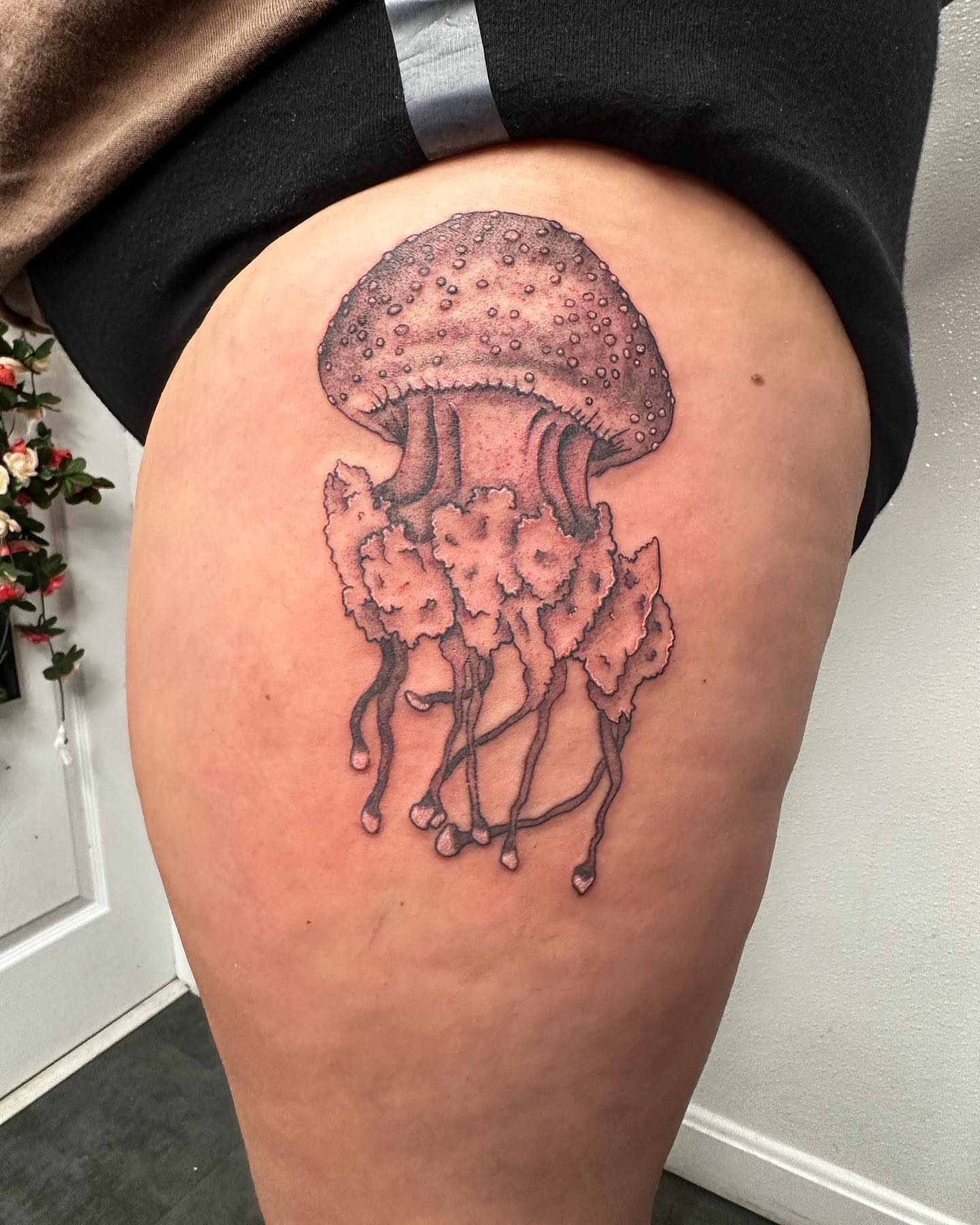 Jellyfish dotwork tattoo on the thigh by Jakki Hicks