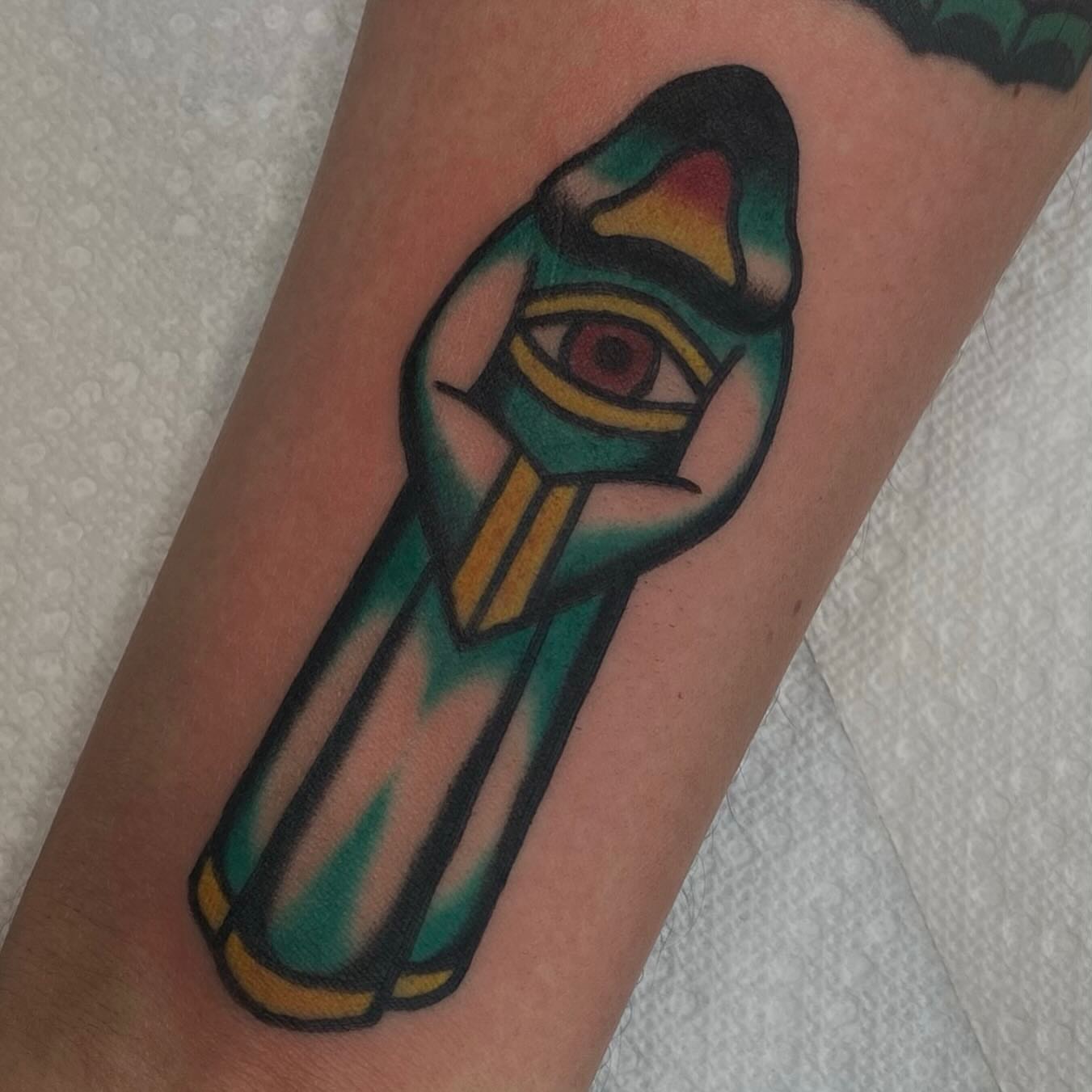 Eye of horus American traditional tattoo on the forearm by Erin Chambers