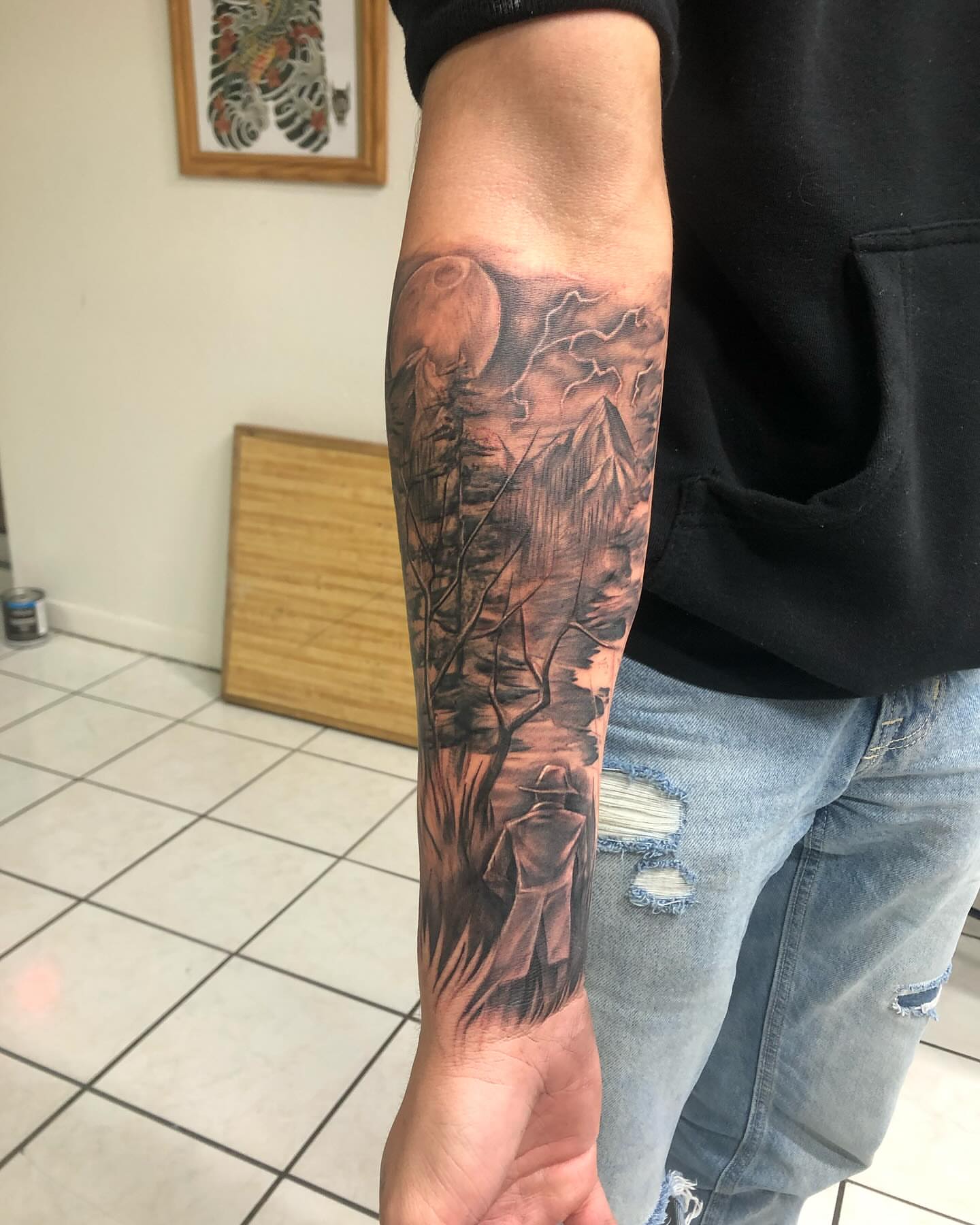 Forest landscape realism tattoo on the forearm by Saint Jimmy