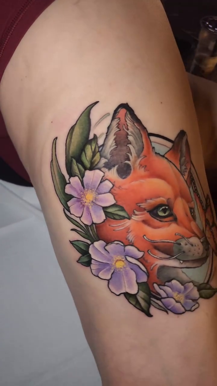 Fox head with flowers neo-traditional tattoo by Ashlynn Campbell